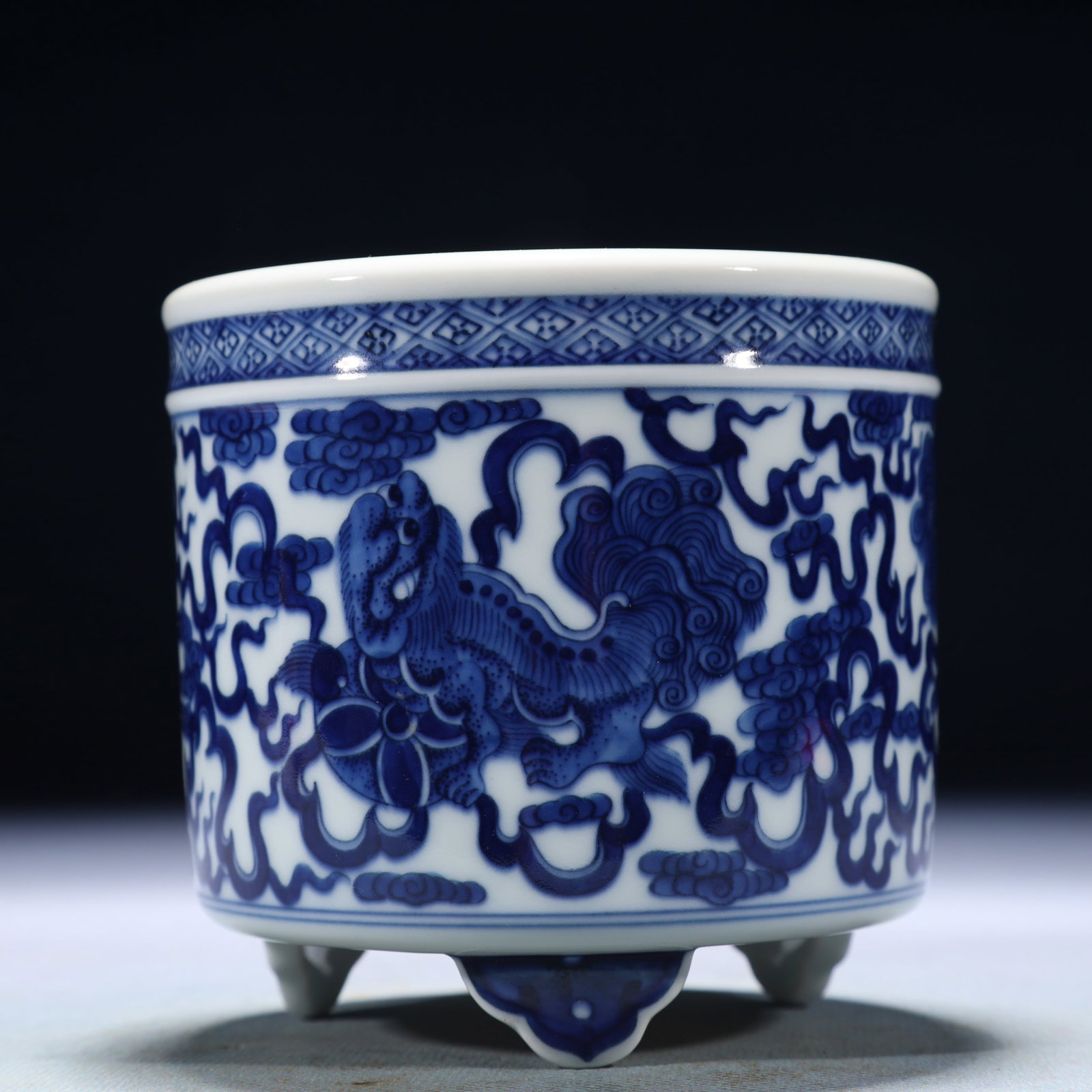 An Exquisite Blue and White Lion Pattern Tripod Censer: An Exquisite Blue and White Lion Pattern Tripod Censer,Qing Dynasty,China,Yongzheng Six-character Mark,Size:3.9inx3.7in,Weight:700g 青花狮子纹三足香