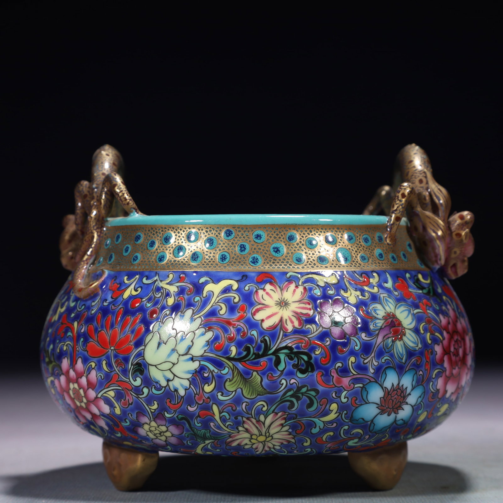 An Exquisite Blue Ground Famille-Rose Lotus Pattern Double-Ears and Tripod Censer: An Exquisite Blue Ground Famille-Rose Lotus Pattern Double-Ears and Tripod Censer,Qing Dynasty,China,Yongzheng Four-character Mark,Size:5.5inx4.5in,Weight:700g