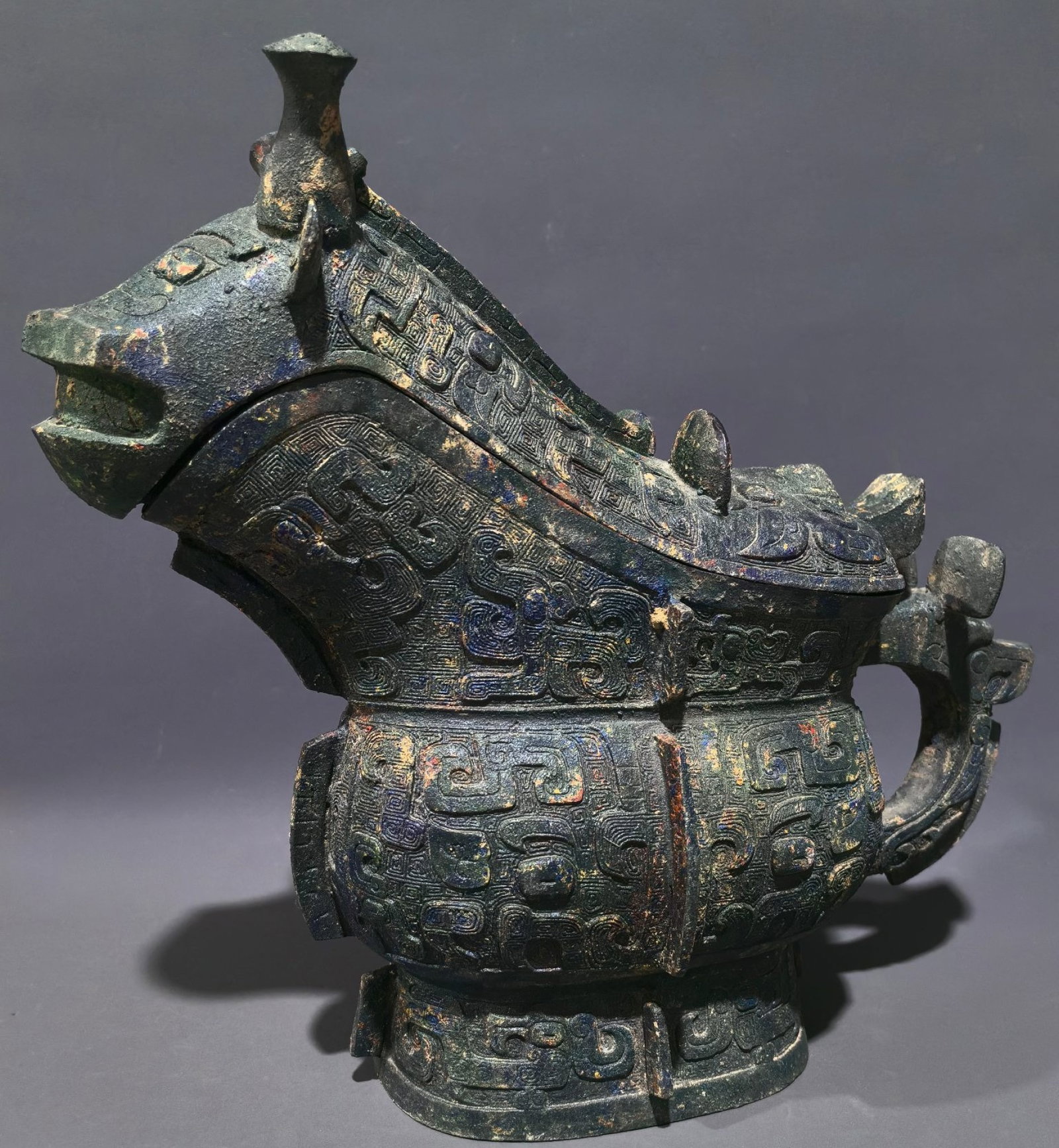 An Archaic Bronze Taotie Pattern Beast-Shaped Cup: An Archaic Bronze Taotie Pattern Beast-Shaped Cup,Shang and Zhou Dynasty, China,Size:11inx12.6inx5.5in,Weight:3.5kg 中国商周时期饕餮纹青&