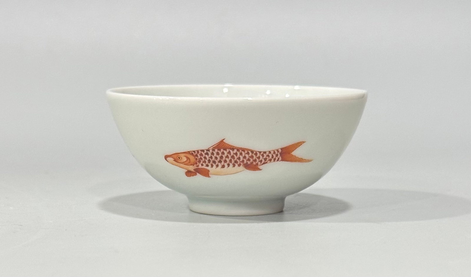 An Exquisite Iron-Red Fish Pattern Cup: An Exquisite Iron-Red Fish Pattern Cup,Qing Dynasty,China,Yongzheng Six-character Mark,Size:1.2inx2.6in 矾红鱼纹杯子,中国清代,雍ઽ