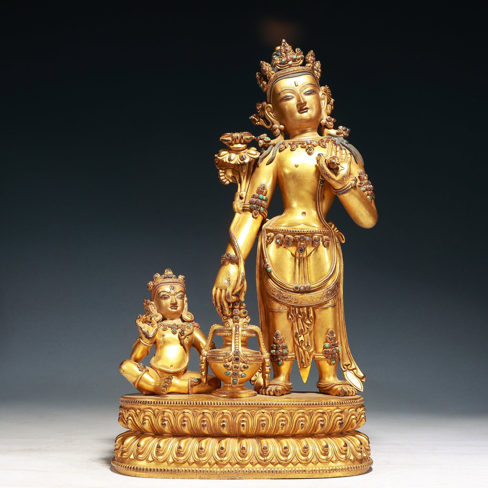 A Solemn Gilt Bronze Buddha Statue,Inlaid Turquoise: A Solemn Gilt Bronze Buddha Statue,Inlaid Turquoise,Ming Dynasty, China,Yongle Six-character Mark,Size:8.7inx3.9inx16.5in,Weight:6600g 铜鎏金佛像,嵌绿松