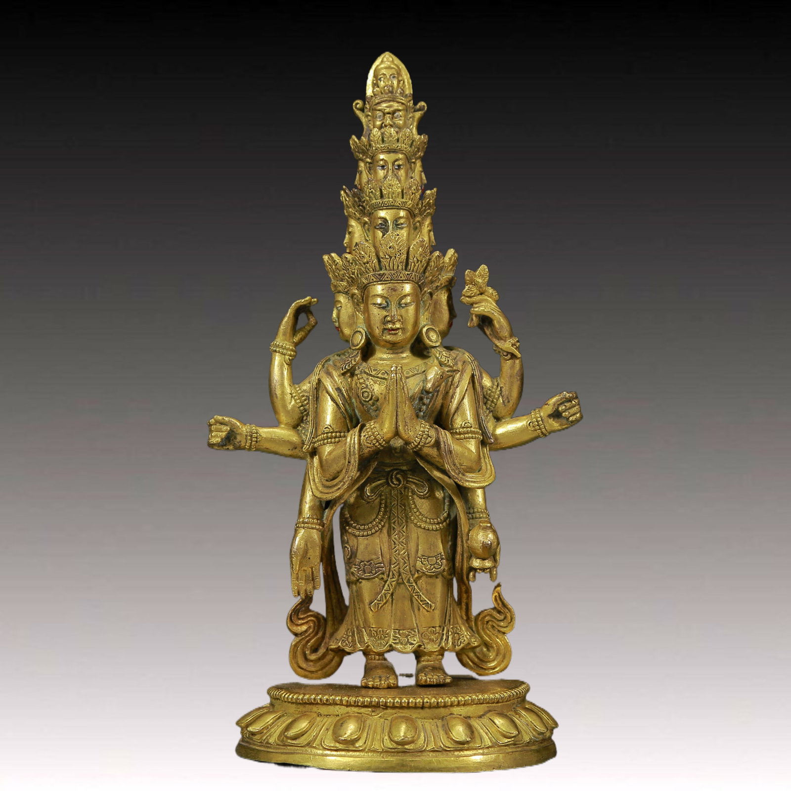 A Solemn Gilt Bronze Eleven-Headed and Eight-Armed Buddha: A Solemn Gilt Bronze Eleven-Headed and Eight-Armed Buddha ,Ming Dynasty, China,Size: 4.3inx3.7inx8.3in,Weight:1340g 铜鎏金十一面八臂佛像A
