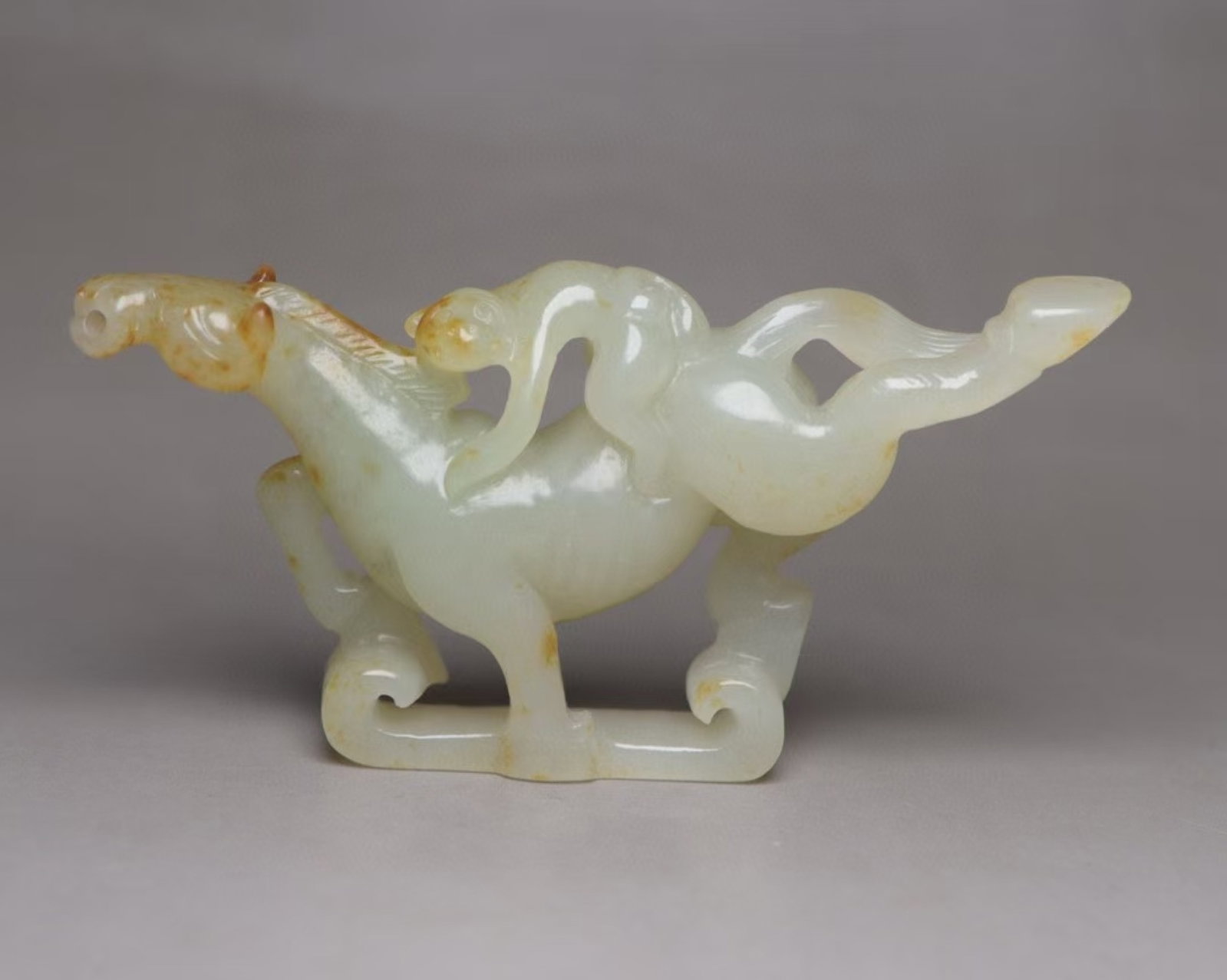 An Exquisite White Jade Horse Ornament: An Exquisite White Jade Horse Ornament,Qing Dynasty,China,Size:3.4inx1.6inx0.6in,Weight:43g 白玉骏马摆件,中国清代