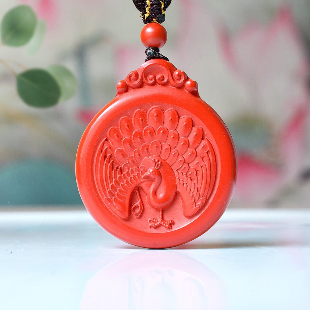 An Exquisite Cinnabar Peacock Pattern Pendant: An Exquisite Cinnabar Peacock Pattern Pendant,Size:1.4inx1.7in,Weight:27.5g 朱砂孔雀纹挂件