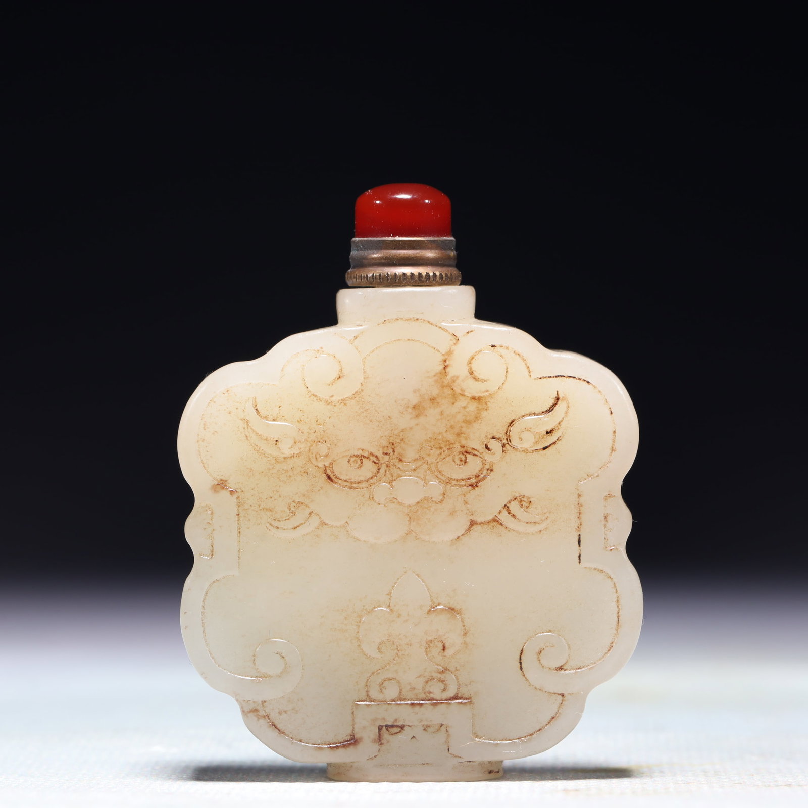 An Exquisite White Jade Beast-Face Pattern Snuff Bottle: An Exquisite White Jade Beast-Face Pattern Snuff Bottle,Qing Dynasty,China,Size:1.8inx0.5inx2.4in,Weight:66.7g