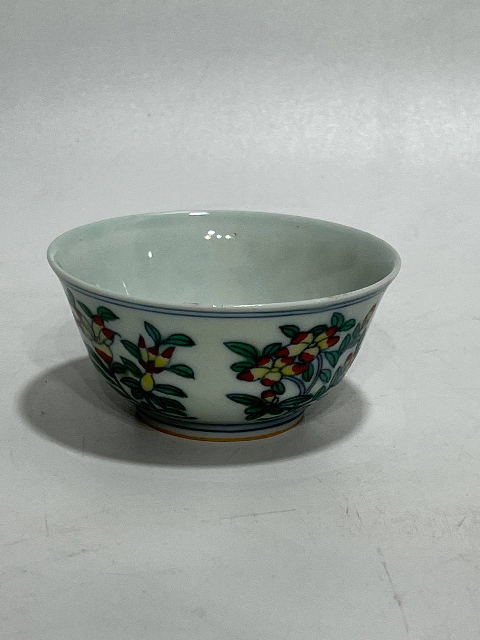 An Exquisite Wucai Flower and Fruit Pattern Cup: An Exquisite Wucai Flower and Fruit Pattern Cup,Ming Dynasty,China,Jiajing Six-character Mark,Size:3in 五彩花果纹杯,中国明代,嘉靖
