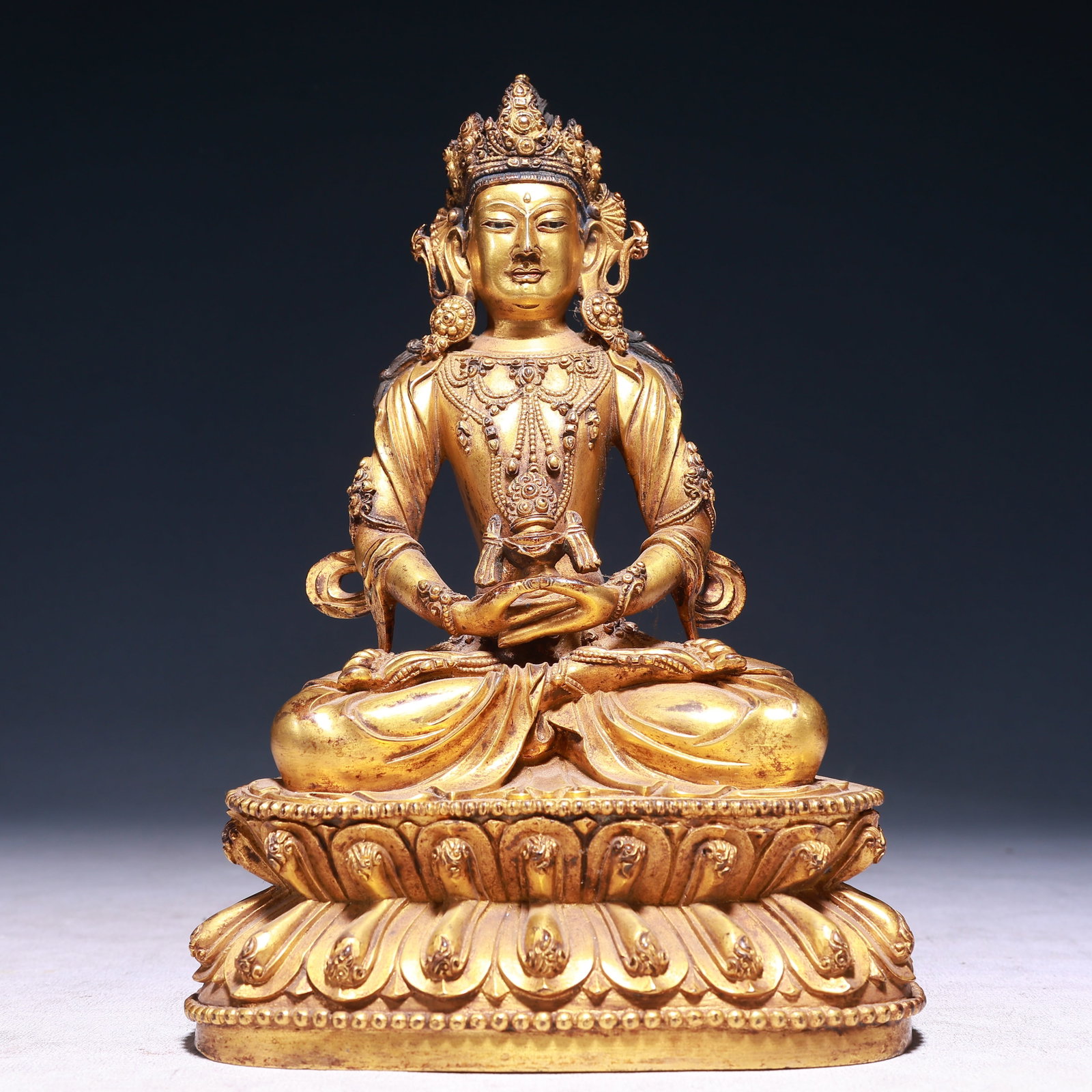 A Solemn Gilt Bronze Statue of Amitayus: A Solemn Gilt Bronze Statue of Amitayus,Ming Dynasty,China,Yongle Six-character Mark,Size:5.9inx4.3inx9.1in,Weight:2600g 铜鎏金无量寿佛像,中ࢲ