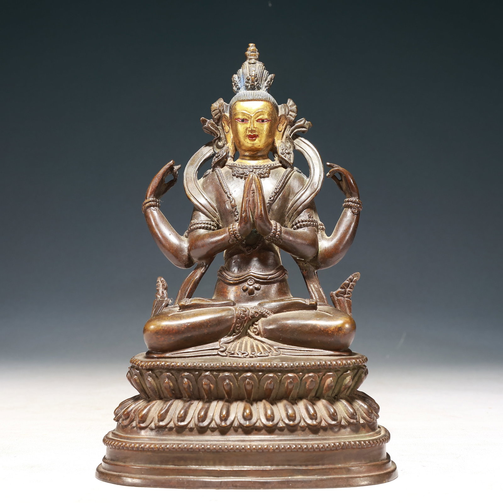 A Solemn Gilt Bronze Statue of Four-arms Avalokitesvara: A Solemn Gilt Bronze Statue of Four-arms Avalokitesvara,Qing Dynasty,China,Size:5.5inx3.1inx9.1in,Weight:2250g 铜鎏金四臂观音像,中国清