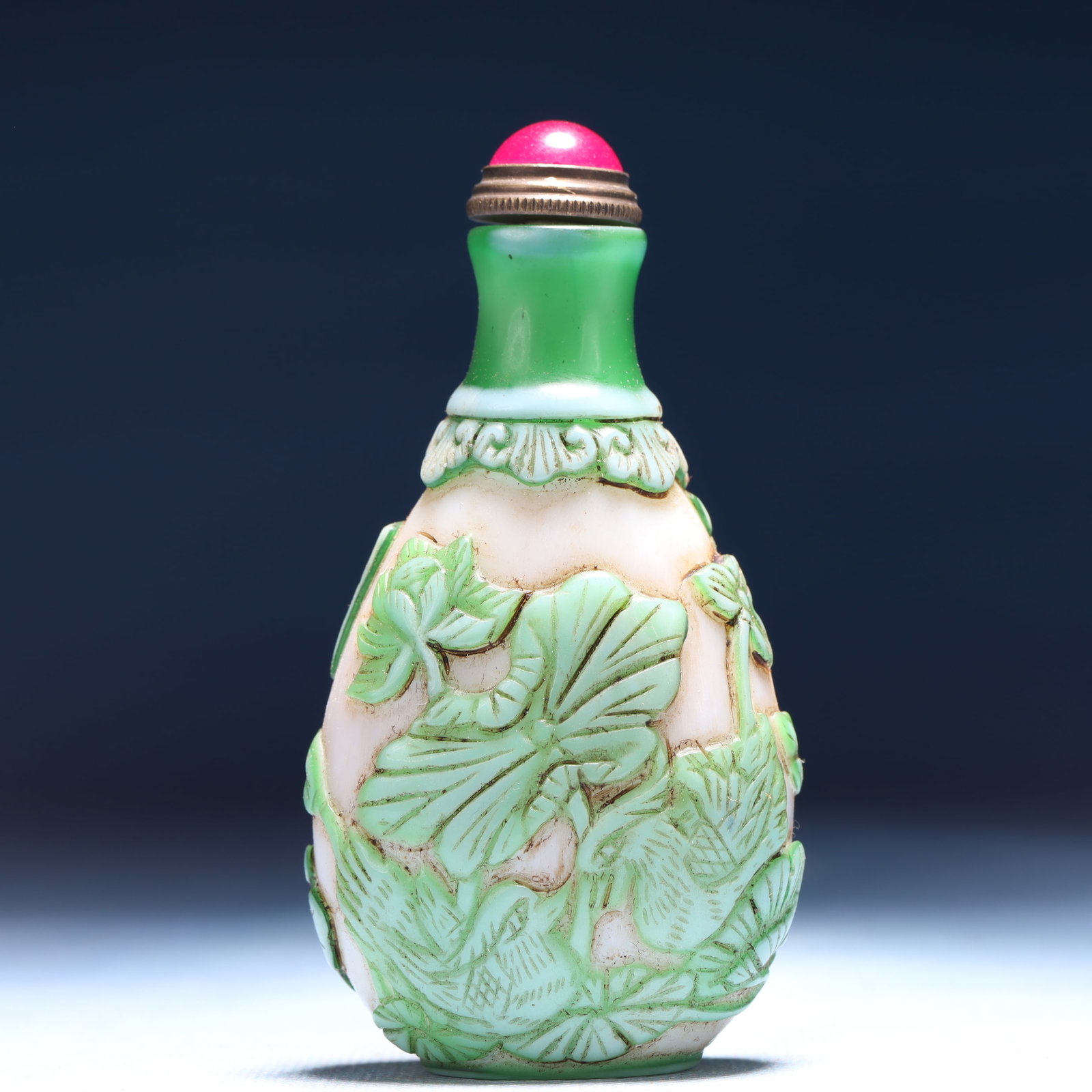 An Exquisite Glass Flower and Mandarin Duck Pattern Snuff Bottle: An Exquisite Glass Flower and Mandarin Duck Pattern Snuff Bottle,Qing Dynasty,China,Qianlong Four-character Mark,Size:2inx1.2inx3.5in,Weight:59g 琉璃花卉鸳鸯纹