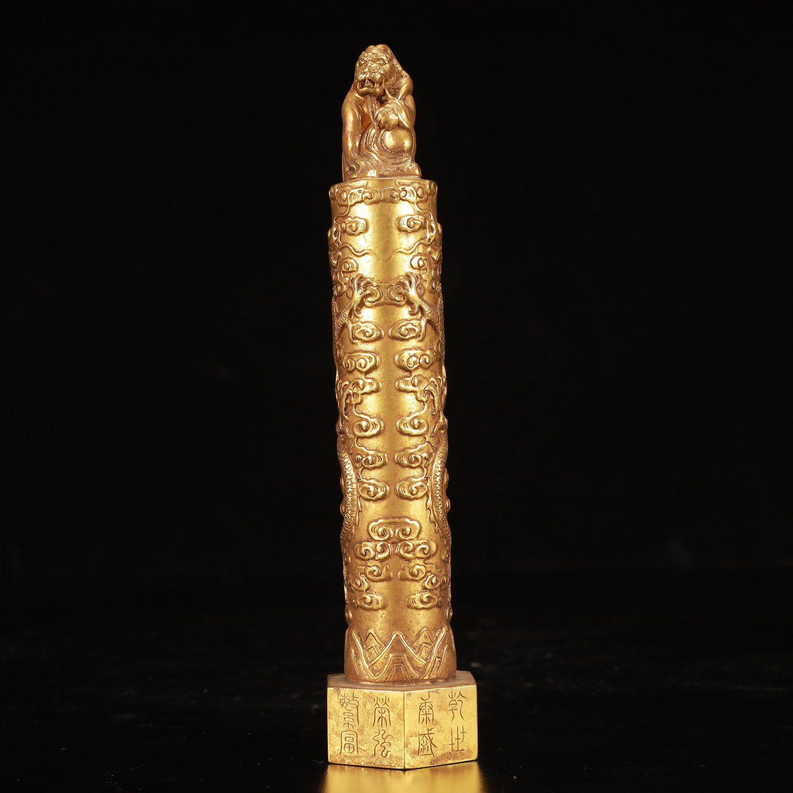 An Exquisite Gilt Bronze Auspicious Cloud and Dragon Pattern Seal: An Exquisite Gilt Bronze Auspicious Cloud and Dragon Pattern Seal,Qing Dynasty, China,Size:1.6inx7.5in,Weight:850g 铜鎏金祥云龙纹印章,中