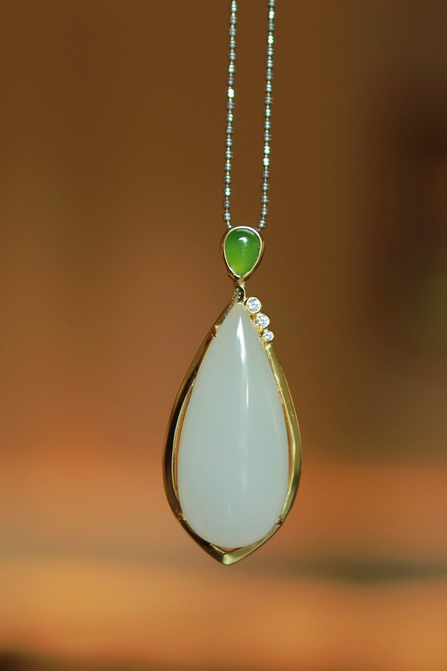 A Set of Fine Sterling Silver-Gold Plated Inlaid White Jade Necklace,Inlaid Diamond: A Set of Fine Sterling Silver-Gold Plated Inlaid White Jade Necklace,Inlaid Diamond,Size:(Necklace)0.8inx2in,(Ring)0.3inx0.7in,(Earring)0.5inx1.7in 一套纯银镀金&
