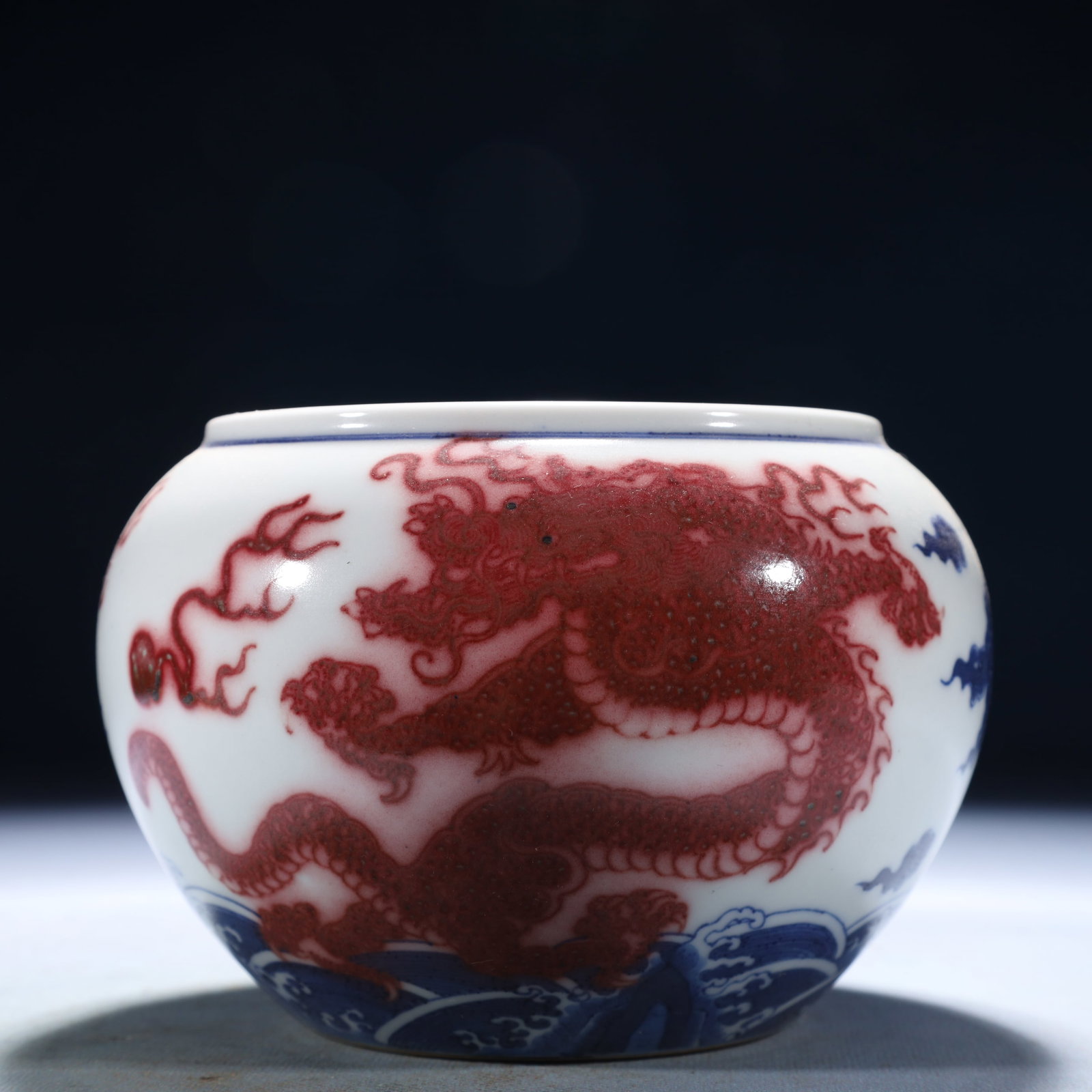An Exquisite Blue and White Underglaze-Red Seawater and Dragon Pattern Jar: An Exquisite Blue and White Underglaze-Red Seawater and Dragon Pattern Jar,Qing Dynasty,China,Kangxi Six-character Mark,Size:5.9inx4.3in,Weight:1300g