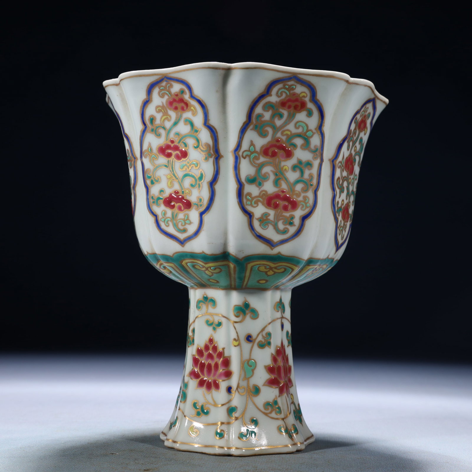 An Exquisite Wucai Lotus Pattern Stem Cup: An Exquisite Wucai Lotus Pattern Stem Cup,Ming Dynasty,China,Xuande Six-character Mark,Size:5.5inx6.9in,Weight:600g 五彩缠枝莲纹高足杯,中