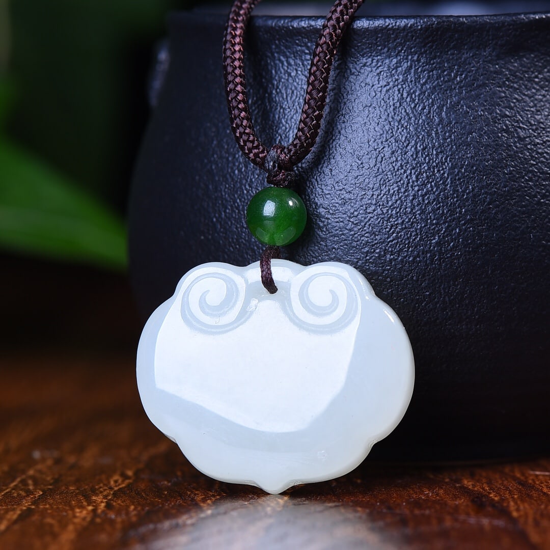 An Exquisite White Jade Pendant: An Exquisite White Jade Pendant,Size:1.3inx1.1in 白玉挂件