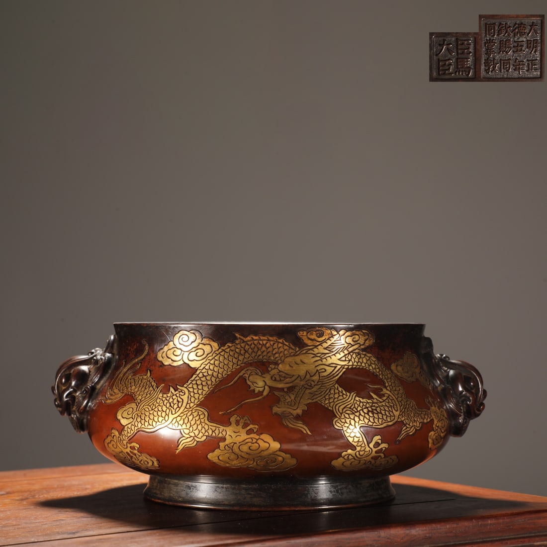 An Exquisite Gilt Bronze Auspicious Cloud and Dragon Pattern Beast-Ears Censer: An Exquisite Gilt Bronze Auspicious Cloud and Dragon Pattern Beast-Ears Censer,Ming Dynasty,China,with Mark,Size:3.7inx7.9inx9.3in,Weight:3.2kg 铜鎏金祥云龙纹