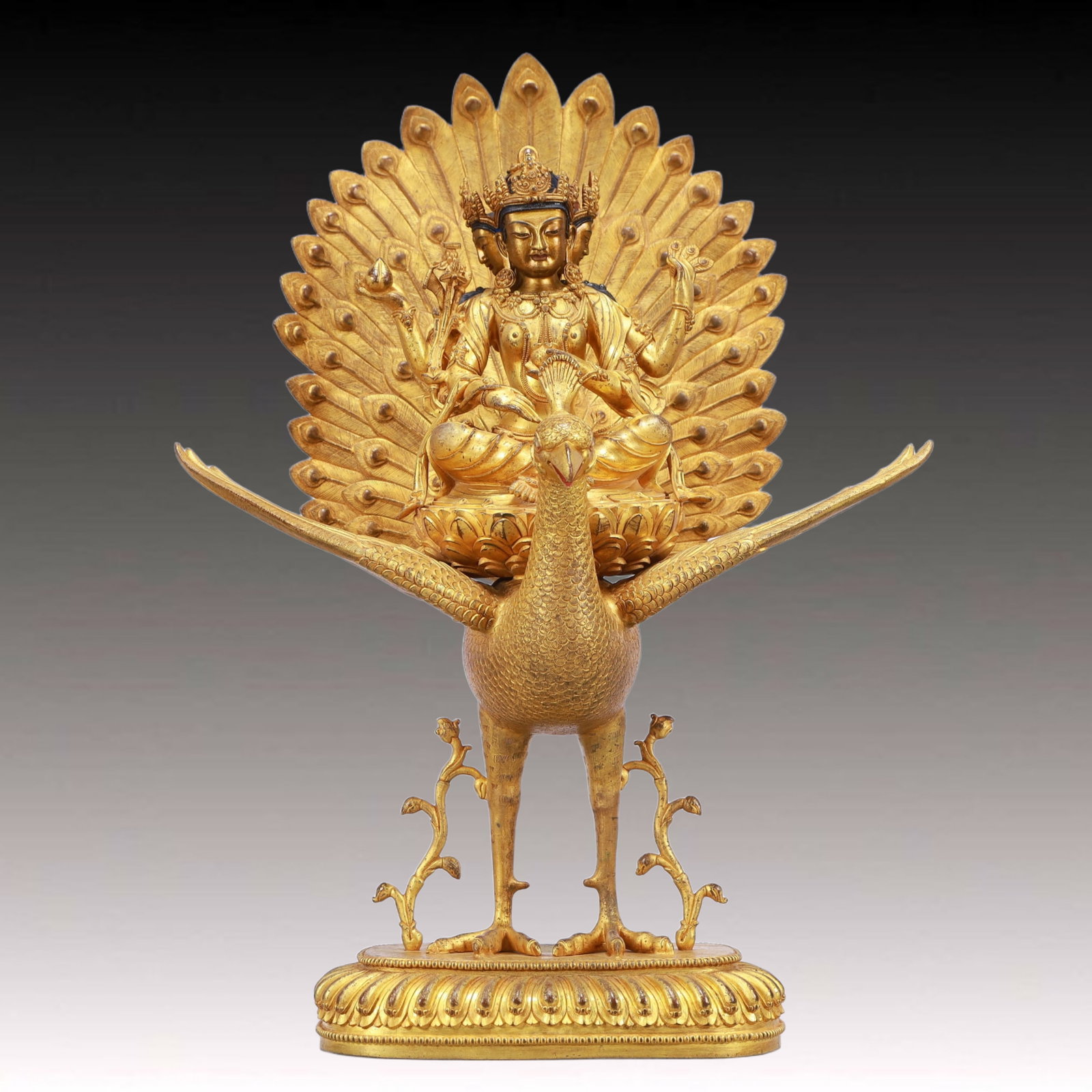 A Solemn Gilt Bronze Peacock Statue of Bodhisattva: A Solemn Gilt Bronze Peacock Statue of Bodhisattva,Ming Dynasty, China,Size:13.4inx7.9inx19.7in,Weight:9550g 铜鎏金孔雀菩萨像,中国明&#