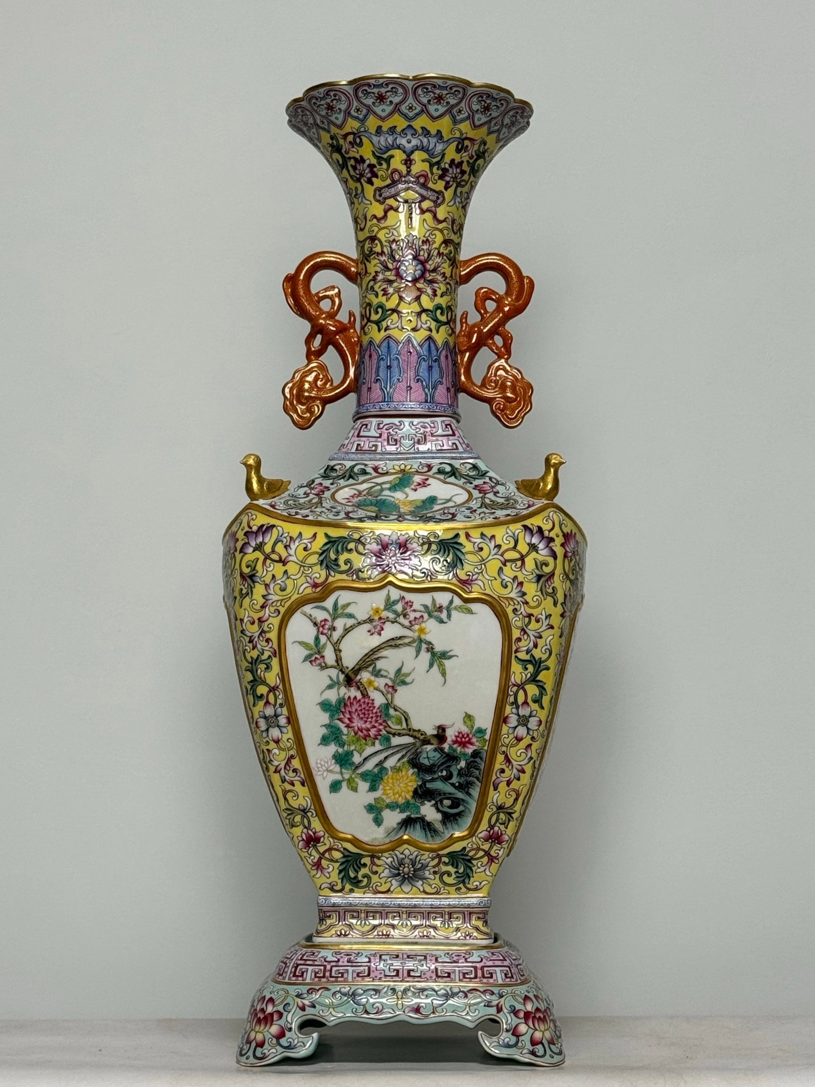 An Exquisite Enamel Yellow Ground Flower and Bird Pattern Double-Ears Vase: An Exquisite Enamel Yellow Ground Flower and Bird Pattern Double-Ears Vase,Qing Dynasty,China,Qianlong Four-character Mark,Size:22.4inx8.7in 珐琅彩黄地花鸟