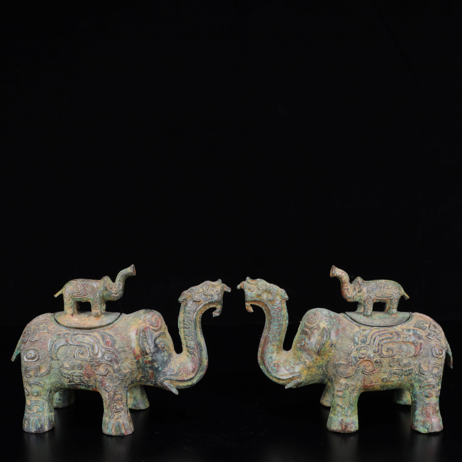 A Pair of Archaic Bronze Elephant Censers: A Pair of Archaic Bronze Elephant Censers,the Warring States Period in China,Size:8.3inx3.1inx9.8in*2,Weight:2100g 一对青铜象纹象香炉,中