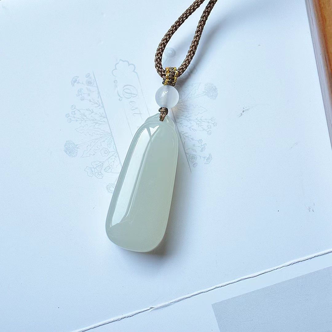 An Exquisite Greenish Jade Pendant (1 of 5)
