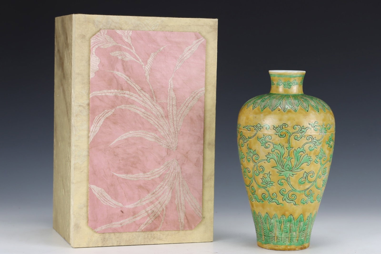 An Exquisite Yellow Ground Green Color Lotus Pattern Vase: An Exquisite Yellow Ground Green Color Lotus Pattern Vase,Ming Dynasty,China,Xuande Six-character Mark,Size:10.1inx5.6in 黄地绿彩缠枝莲纹瓶,ߑ