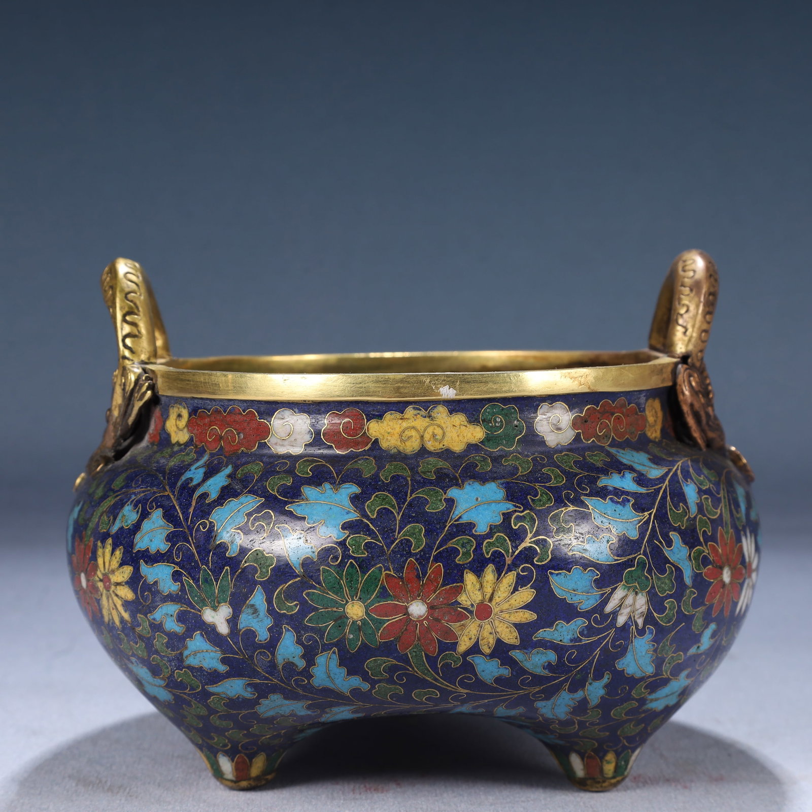 An Exquisite Cloisonne Flower Pattern Dragon-Ears and Tripod Censer: An Exquisite Cloisonne Flower Pattern Dragon-Ears and Tripod Censer,Ming Dynasty, China,Xuande Four-character Mark,Size:5.9inx4.7in,Weight:1050g 景泰蓝花卉纹龙
