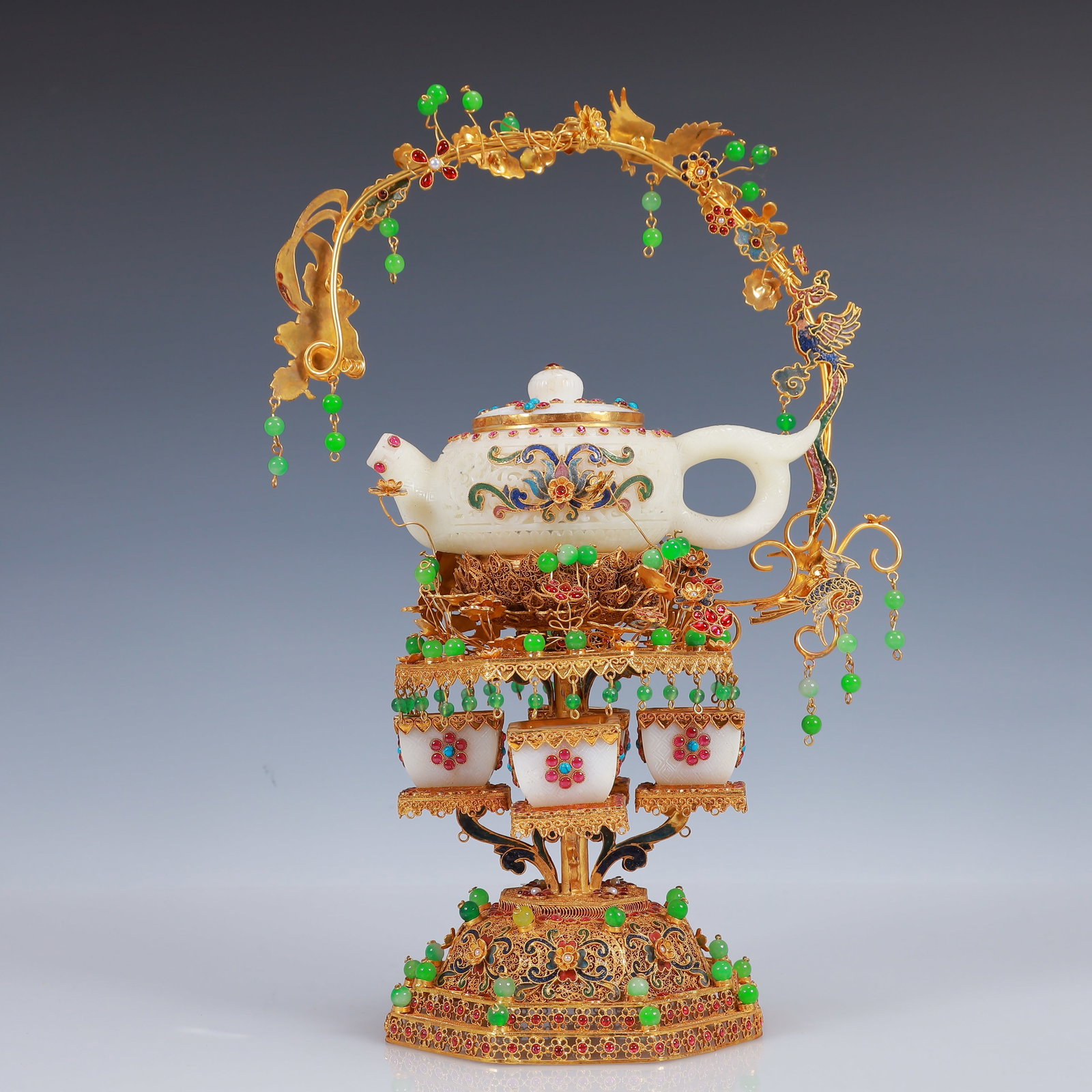 A Set of Fine Filigree and Gilding Inlaid White Jade Teapots,Inlaid Gems: A Set of Fine Filigree and Gilding Inlaid White Jade Teapots,Inlaid Gems,Qing Dynasty, China,Qianlong Four-Character Mark,Size:9.8inx5.9inx15in,Weight:1750g 一套花丝鎏