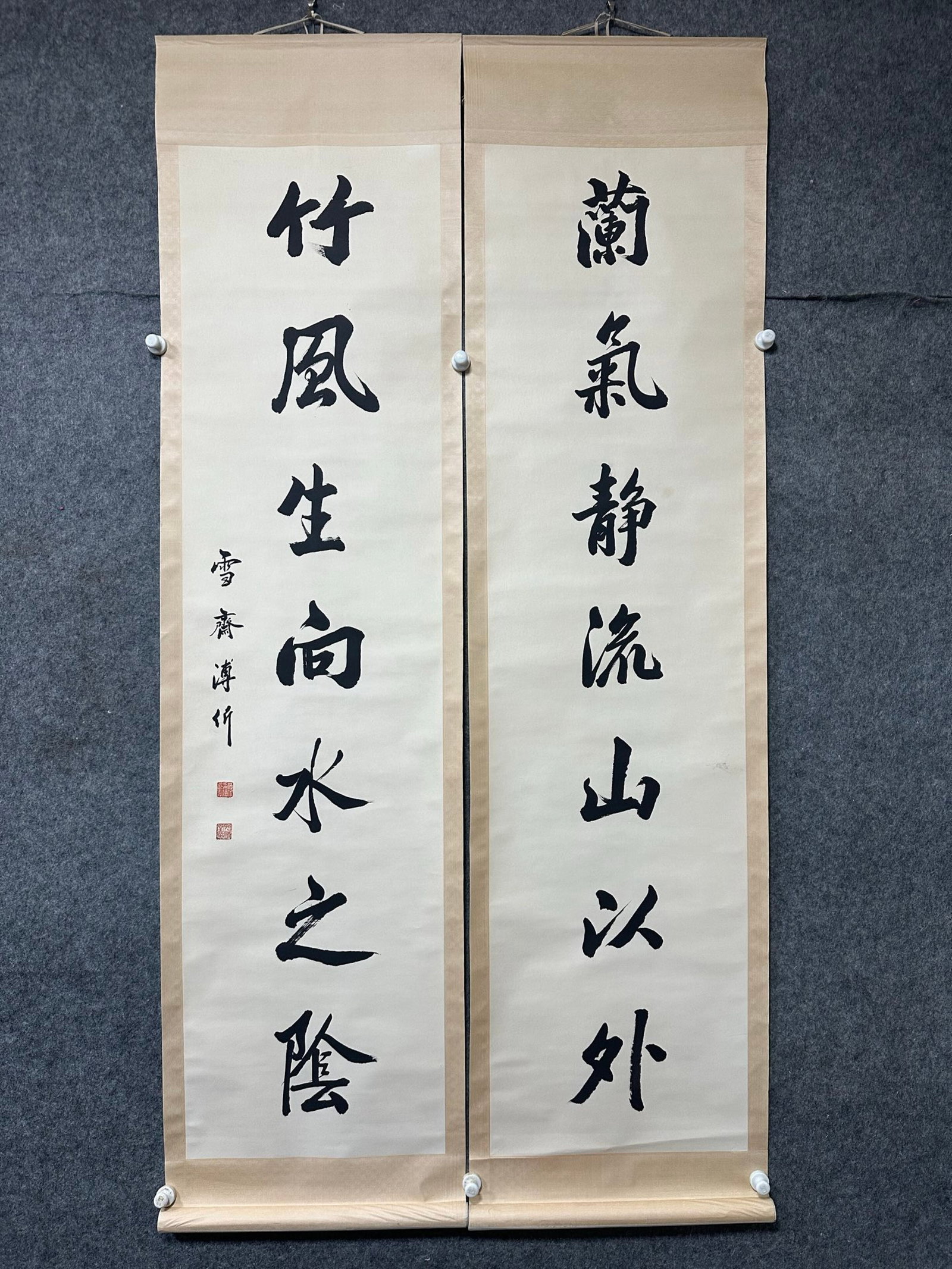 A Chinese Vertical Scroll Ink Calligraphy Couplet on Paper: A Chinese Vertical Scroll Ink Calligraphy Couplet on Paper,Pu Yi,Size:18.1inx70.5in*2 一副中国水墨书法对联立轴,溥仪