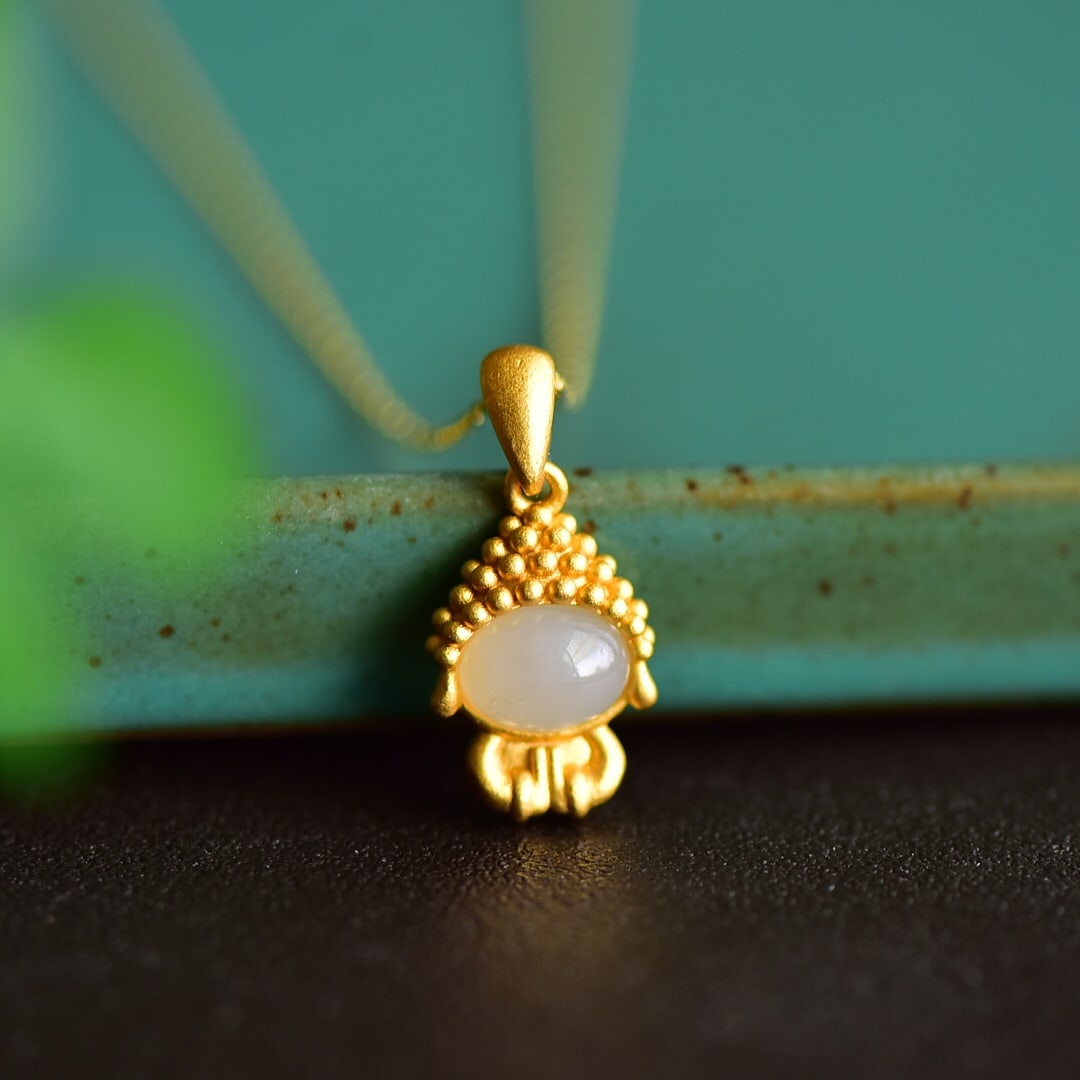 An Exquisite Sterling Silver-Gold Plated Inlaid White Jade Pendant: An Exquisite Sterling Silver-Gold Plated Inlaid White Jade Pendant 纯银镀金镶白玉吊坠