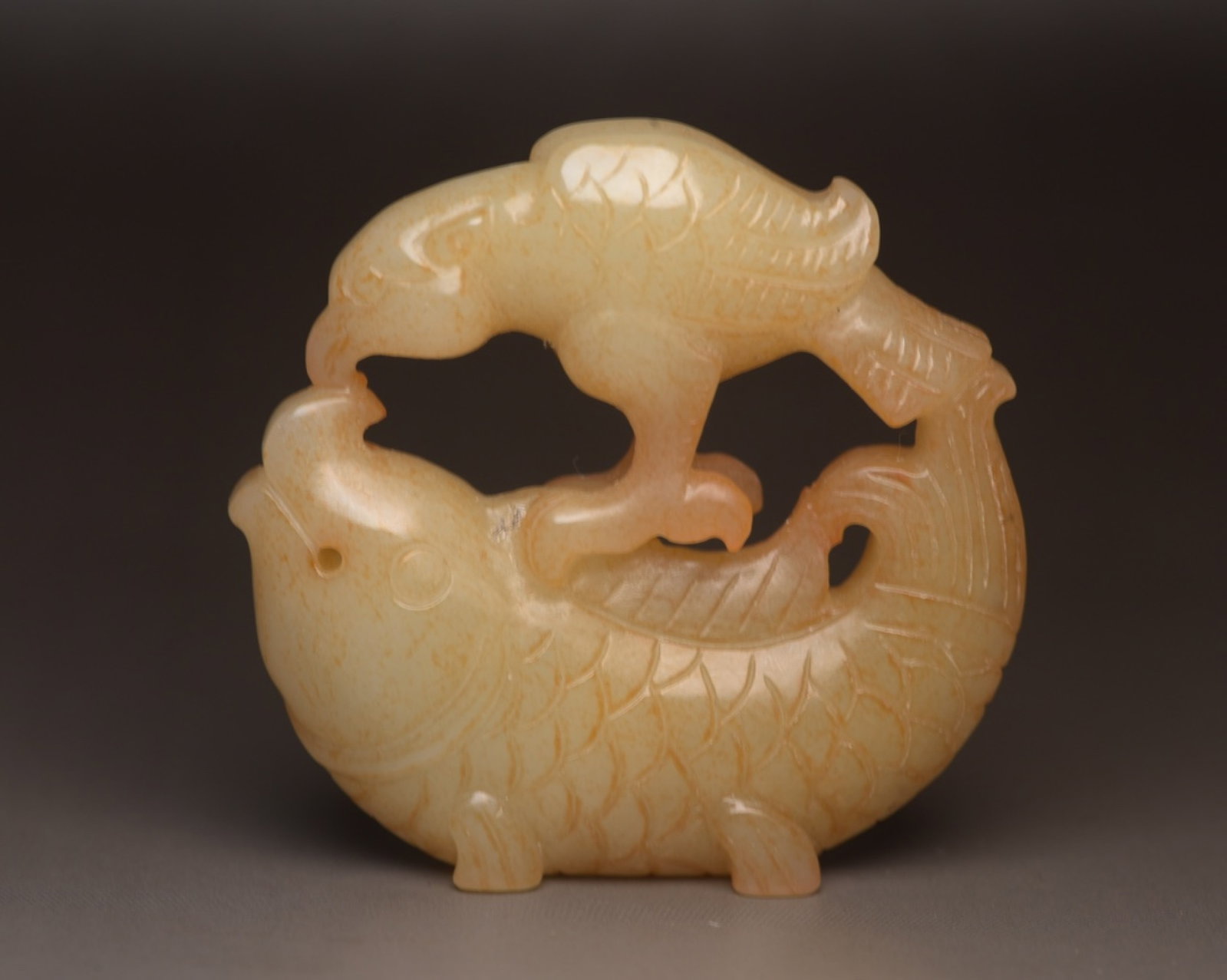 An Exquisite White Jade Fish Ornament: An Exquisite White Jade Fish Ornament,Qing Dynasty,China,Size:2.1inx2inx0.5in,Weight:53g 白玉鱼摆件,中国清代