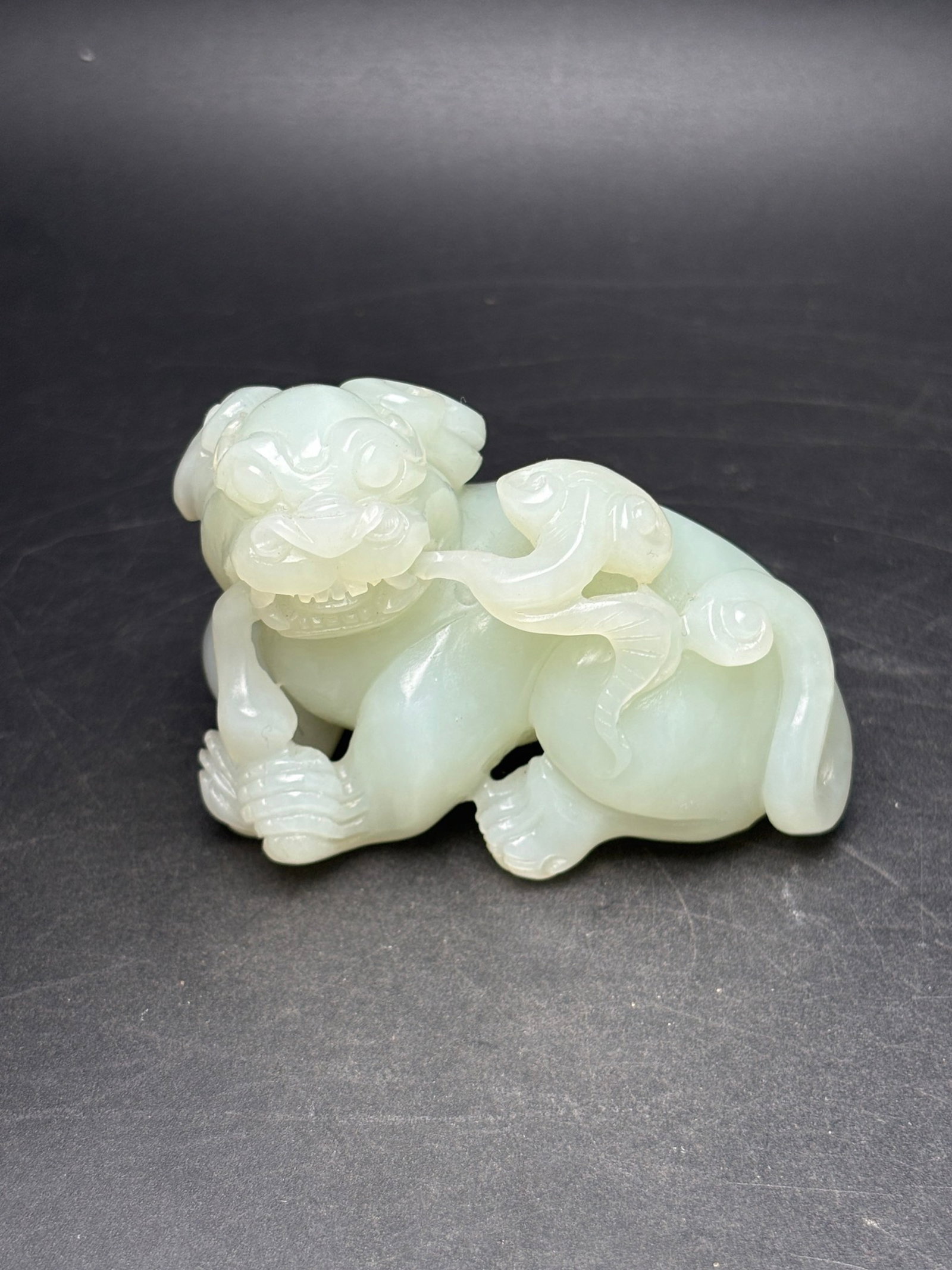 An Exquisite White Jade Auspicious Beast Hand Piece: An Exquisite White Jade Auspicious Beast Hand Piece,Qing Dynasty,China,Size:2.9inx2.2inx1.6in,Weight:199g 白玉瑞兽手把件,中国清代