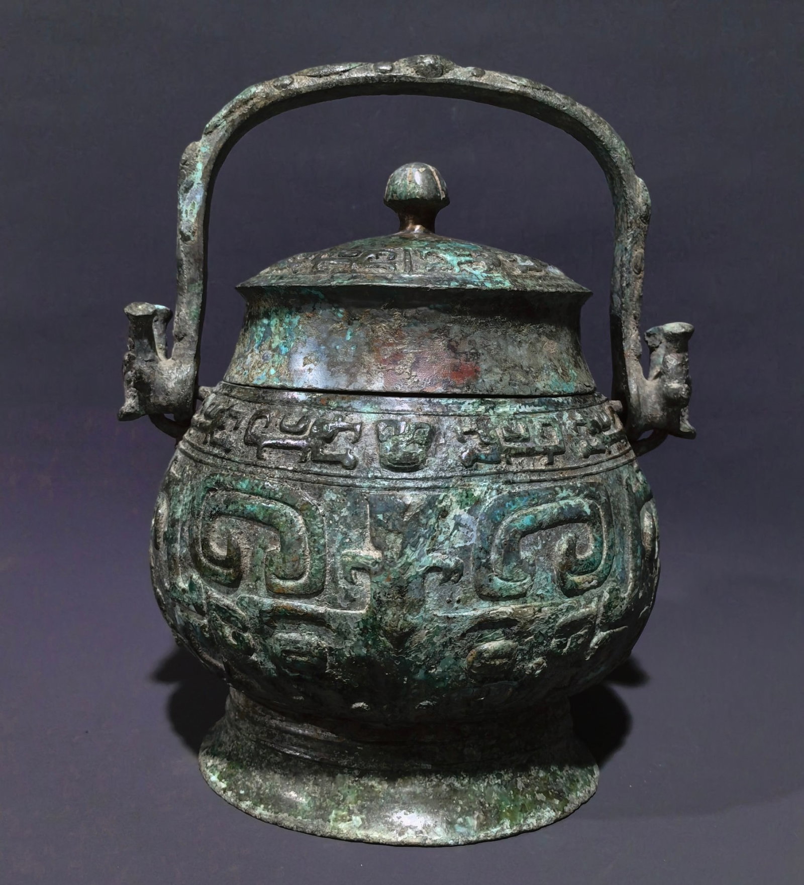 An Archaic Bronze Beast-Face Pattern Ewer,With Inscription: An Archaic Bronze Beast-Face Pattern Ewer,With Inscription,Shang and Zhou Dynasty, China,Size:11.8inx9.4inx5.9in,Weight:4.25kg 中国商周时期兽面纹&