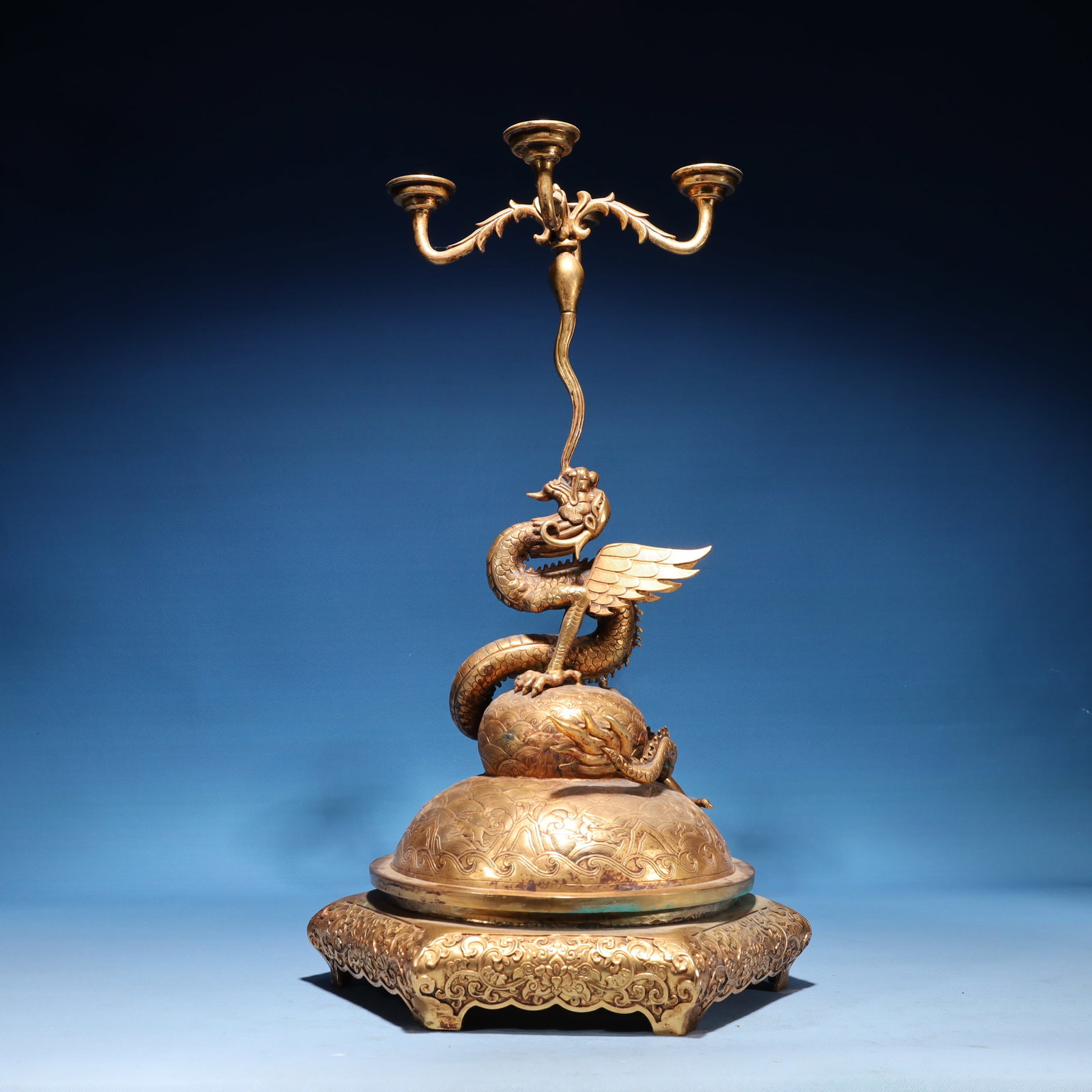 An Exquisite Gilt Bronze Seawater and Beast Pattern Dragon Candlestick: An Exquisite Gilt Bronze Seawater and Beast Pattern Dragon Candlestick,Qing Dynasty,China,Qianlong Six-character Mark,Size:12.6inx21.7in,Weight:6800g 铜鎏金海水兽&#