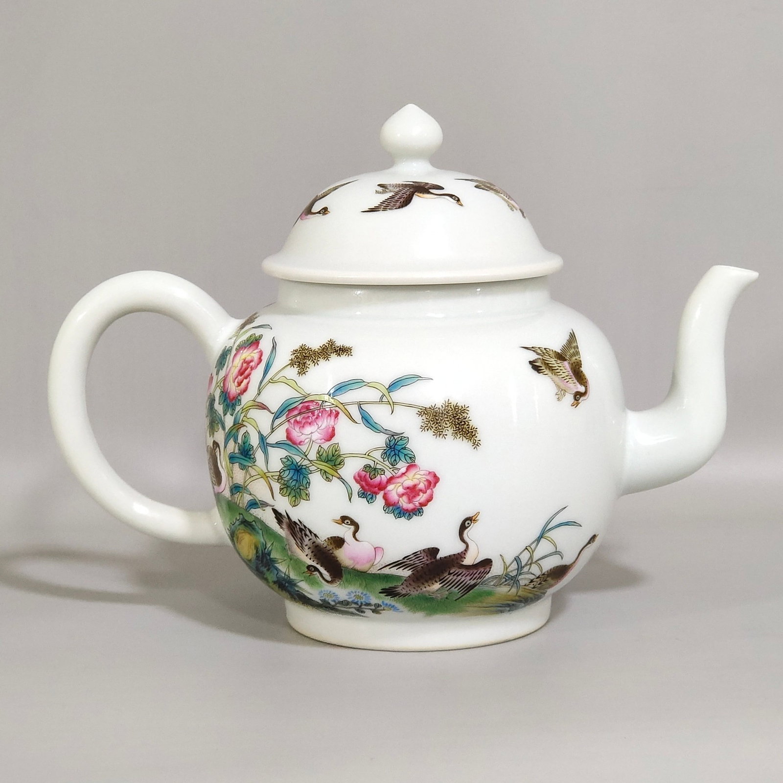 An Exquisite Famille-Rose Flower and Bird Pattern Teapot,With Poem: An Exquisite Famille-Rose Flower and Bird Pattern Teapot,With Poem,Qing Dynasty,China,Qianlong Six-character Mark,Size:5.5inx6.9in