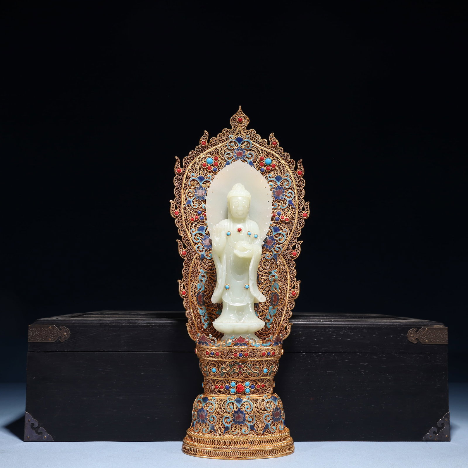 An Exquisite Filigree and Gilding Inlaid White Jade Buddha Statue, Inlaid Gems: An Exquisite Filigree and Gilding Inlaid White Jade Buddha Statue, Inlaid Gems, Qing Dynasty,China, Qianlong Four-character Mark, Size:6.3inx3.1inx15.7in,(Box)19.7inx9.8inx5.5in,Weight:1300g 花&