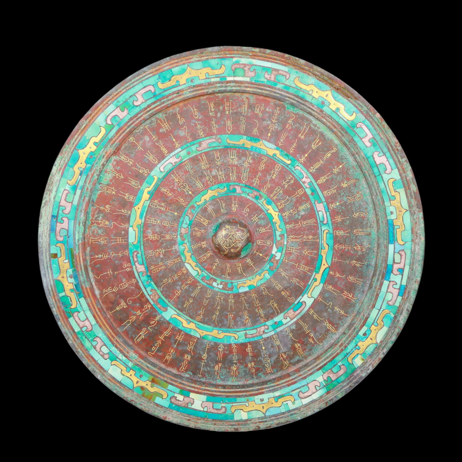 A precious round bronze mirror inlaid with gold and turquoise (1 of 5)