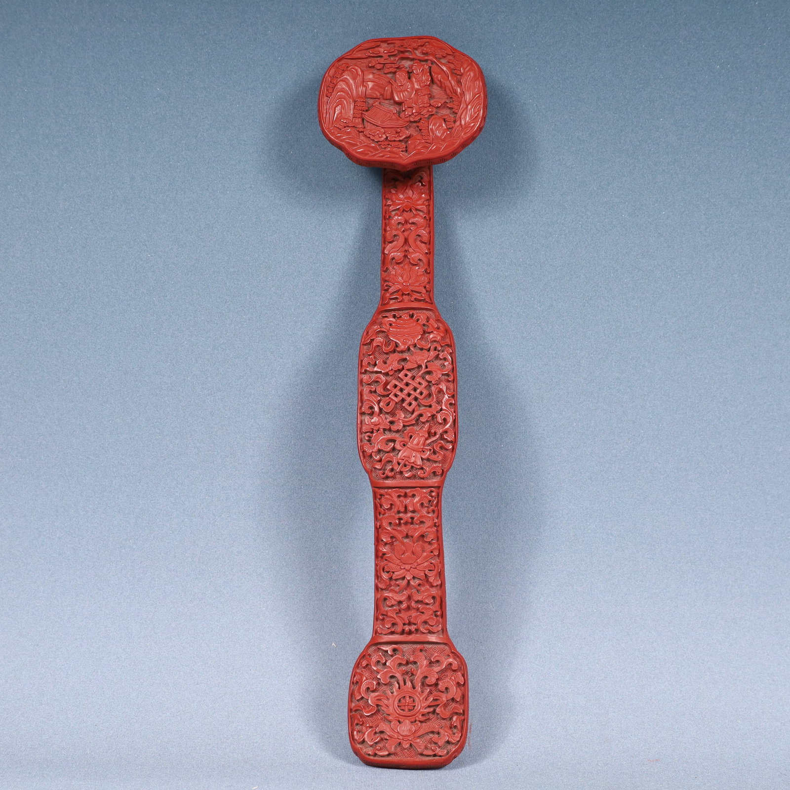 A Rare Carved Red Lacquer Lotus,Landscape and Figure Pattern Ruyi: A Rare Carved Red Lacquer Lotus,Landscape and Figure Pattern Ruyi,Qing Dynasty, China,Size:15.4inx3.5inx2in,Weight:350g