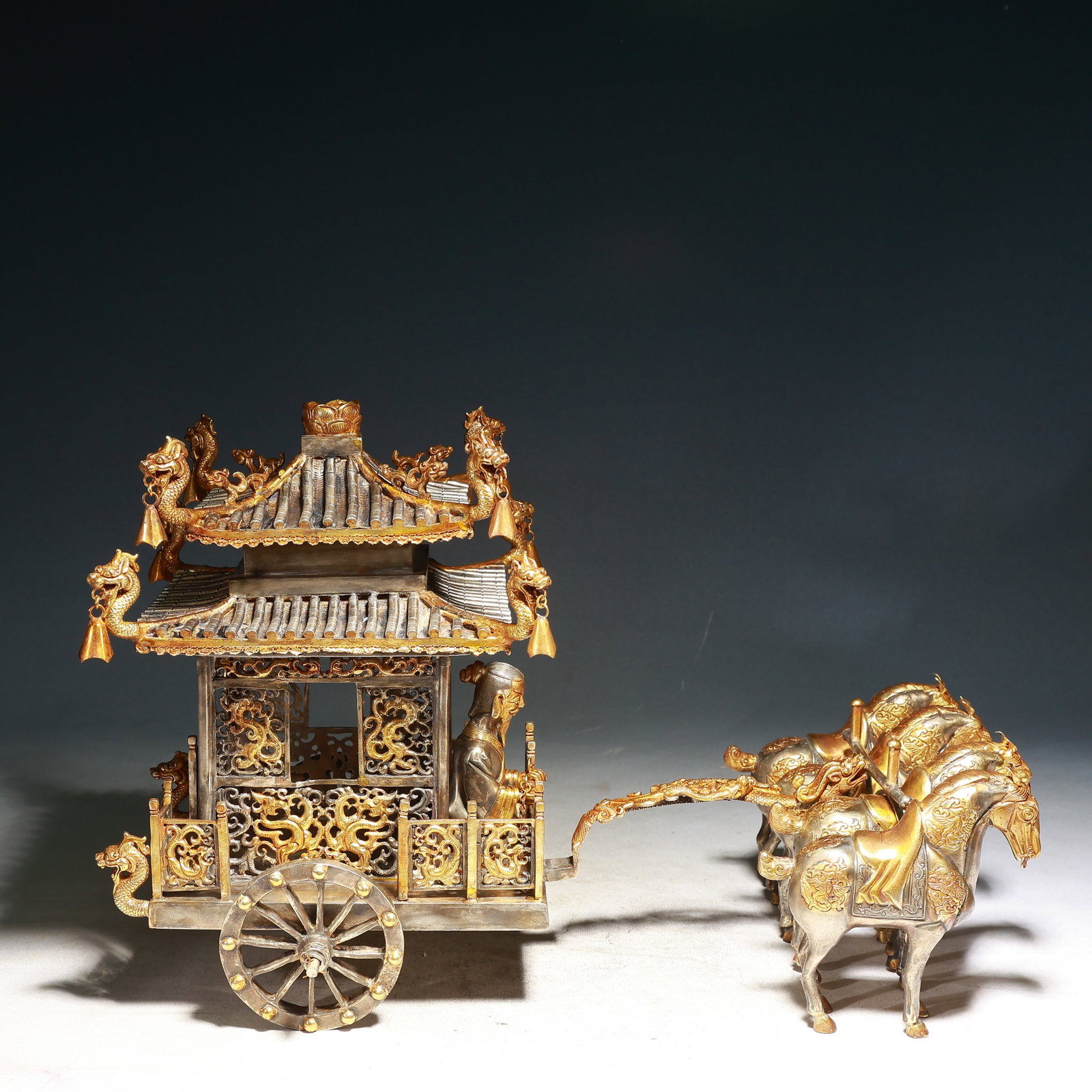 A Huge Silver-Gilt Bronze Dragon and Phoenix Pattern Carriage Ornament: A Huge Silver-Gilt Bronze Dragon and Phoenix Pattern Carriage Ornament,Tang Dynasty,China,Zhenguan Four-character Mark,Size:19.3inx9.4inx12.6in,Weight:7650g