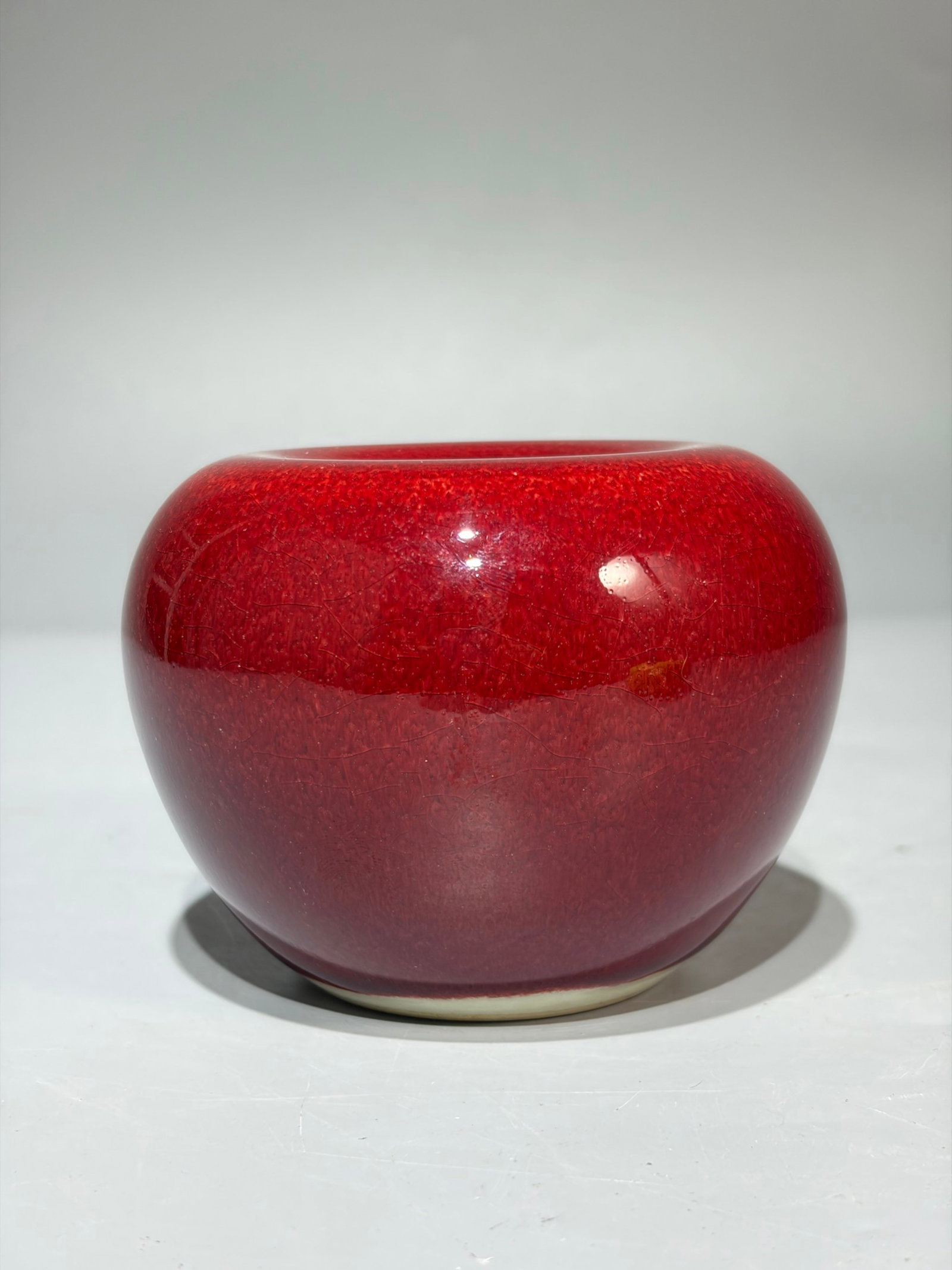 An Exquisite Red Glazed Apple-Shaped Vase: An Exquisite Red Glazed Apple-Shaped Vase,Qing Dynasty,China,Kangxi Six-character Mark,Size:3inx3.7in 红釉苹果形瓶,中国清代,康熙