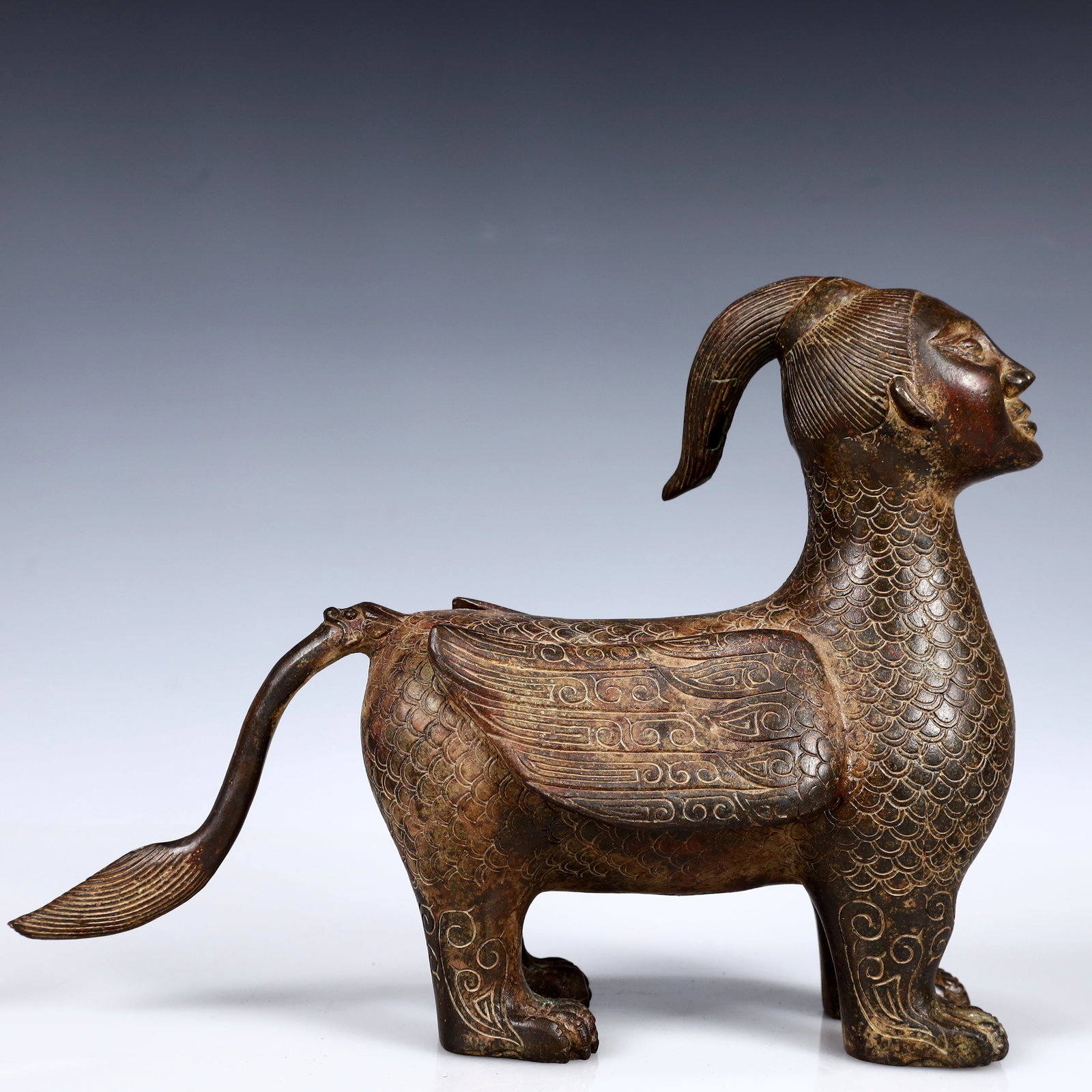 A Rare Bronze Human-Face Beast Ornament (1 of 14)