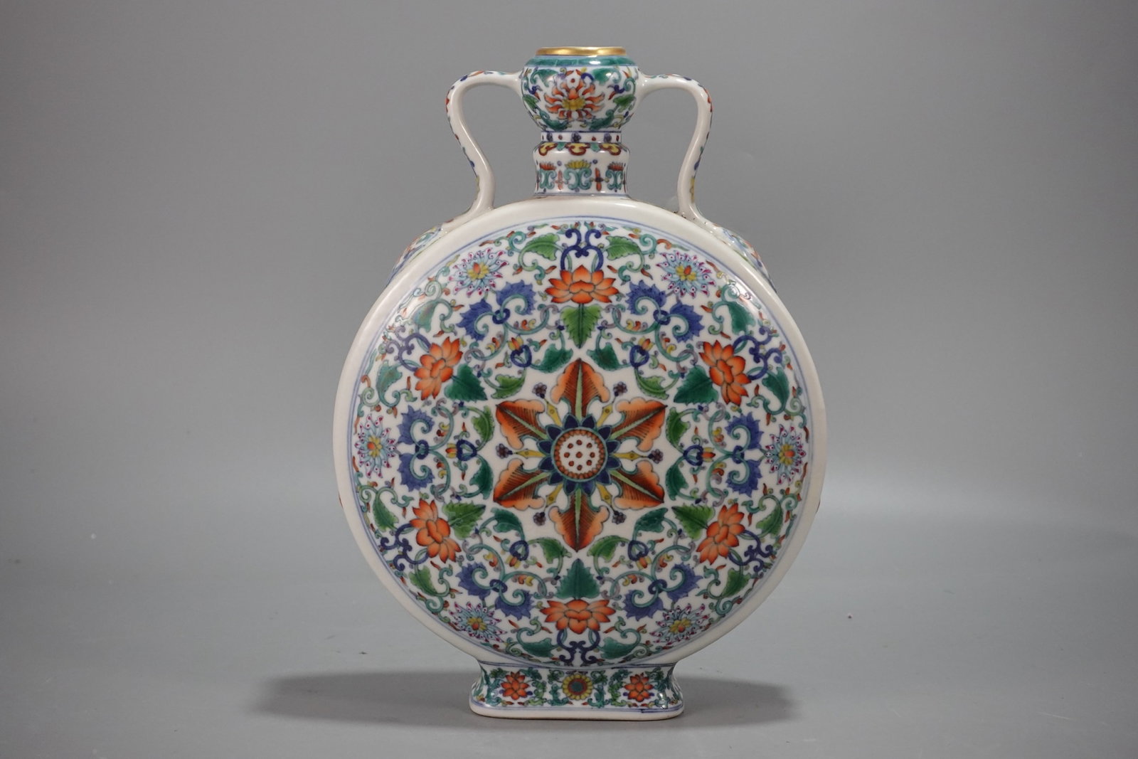 A Rare Doucai Blue and White Painted Gold Lotus Pattern Double-Ears Vase: A Rare Doucai Blue and White Painted Gold Lotus Pattern Double-Ears Vase,Qing Dynasty,China,Qianlong Six-character Mark,Size:11.8inx8.5in 斗彩青花描金缠ੜ