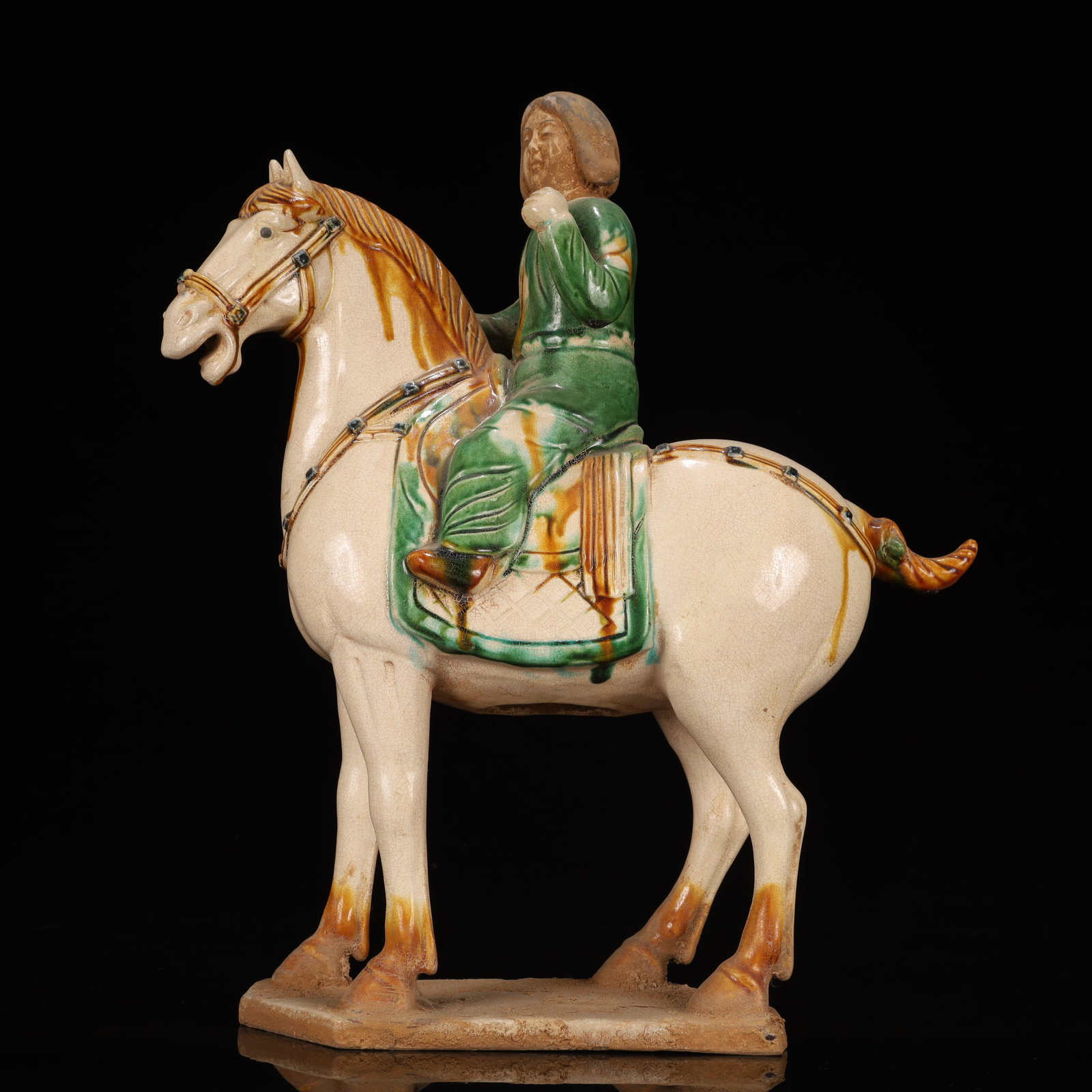 A Rare Tang Tri-Color Glazed Pottery Figure Riding Horse Ornament: A Rare Tang Tri-Color Glazed Pottery Figure Riding Horse Ornament,Tang Dynasty, China,Chinese Tang Tri-colored Pottery, or Tang Sancai, flourished during the Tang Dynasty (618–907 AD). It's