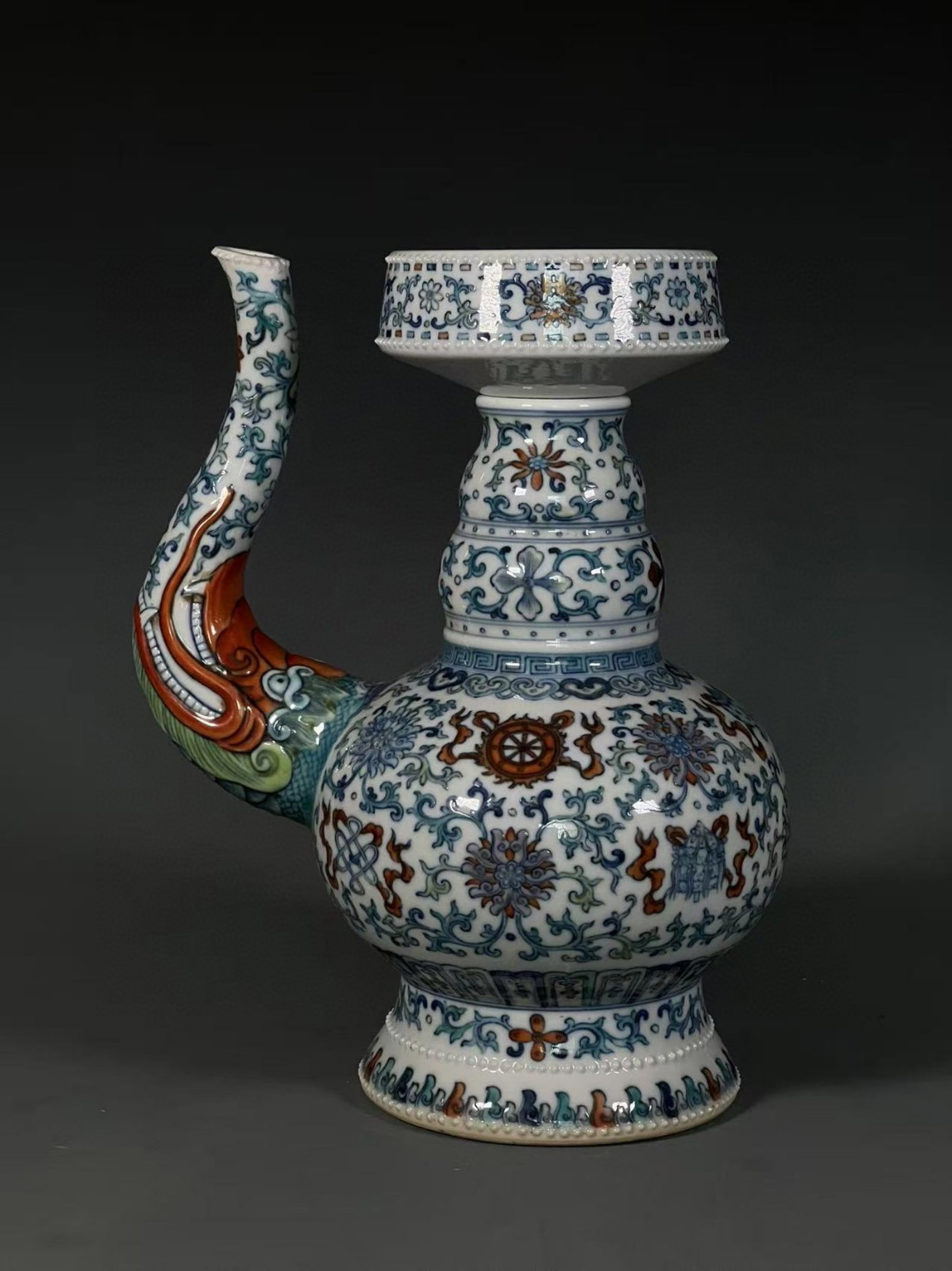 An Exquisite Doucai Lotus and Eight Treasures Pattern Dragon-head Pot: An Exquisite Doucai Lotus and Eight Treasures Pattern Dragon-head Pot,Qing Dynasty,China,Qianlong Six-character Mark,Size:11.8inx2inx5.3in 斗彩缠枝莲八宝ń