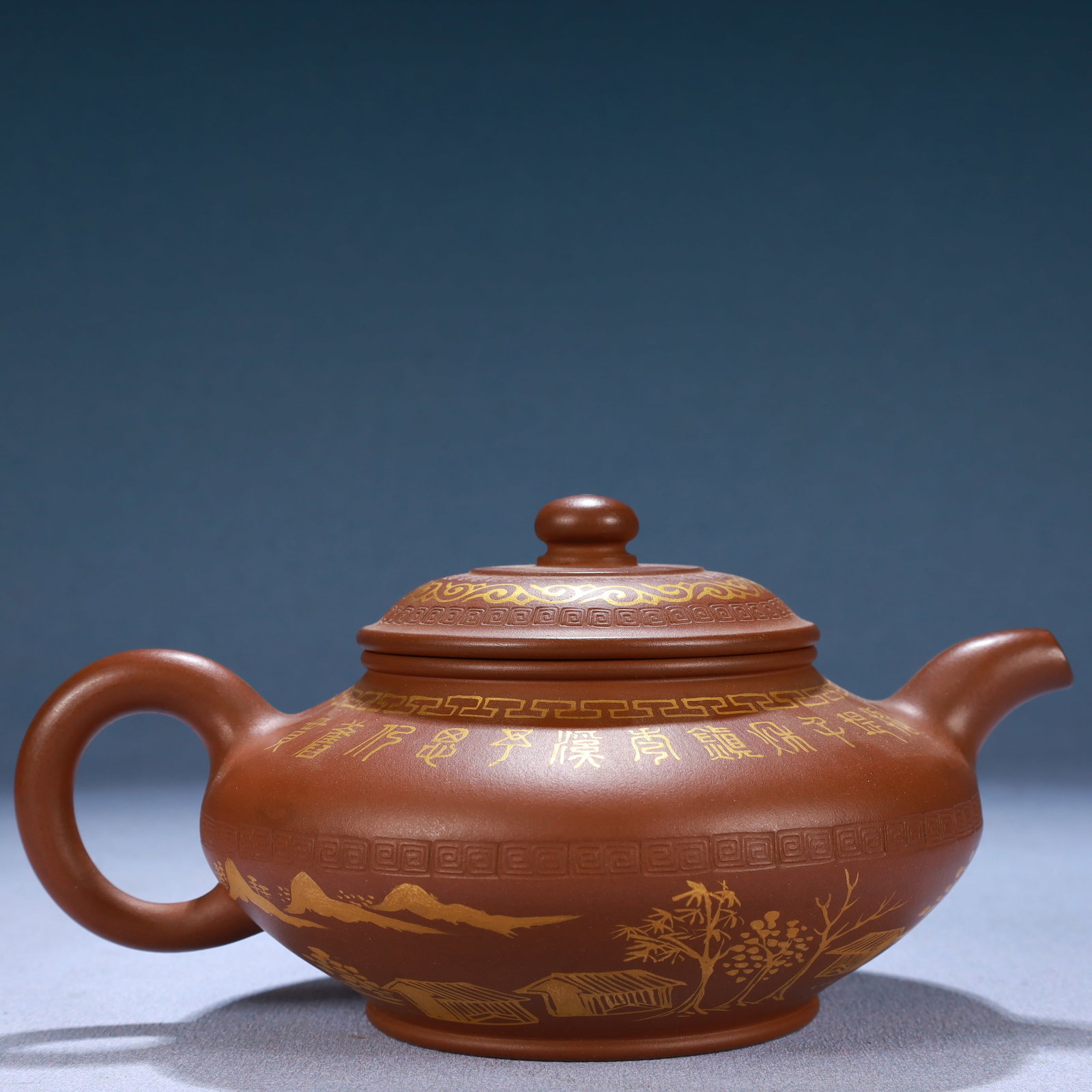 A Brilliant Yixing Clay Gilded 'Landscape' Ewer With Inscriptions: A Brilliant Yixing Clay Gilded 'Landscape' Ewer With Inscriptions. Chinese Qing Dynasty. Qianlong Six-Character Mark. Size:6.9inx4.9inx3.7in. Weight:280g 清代