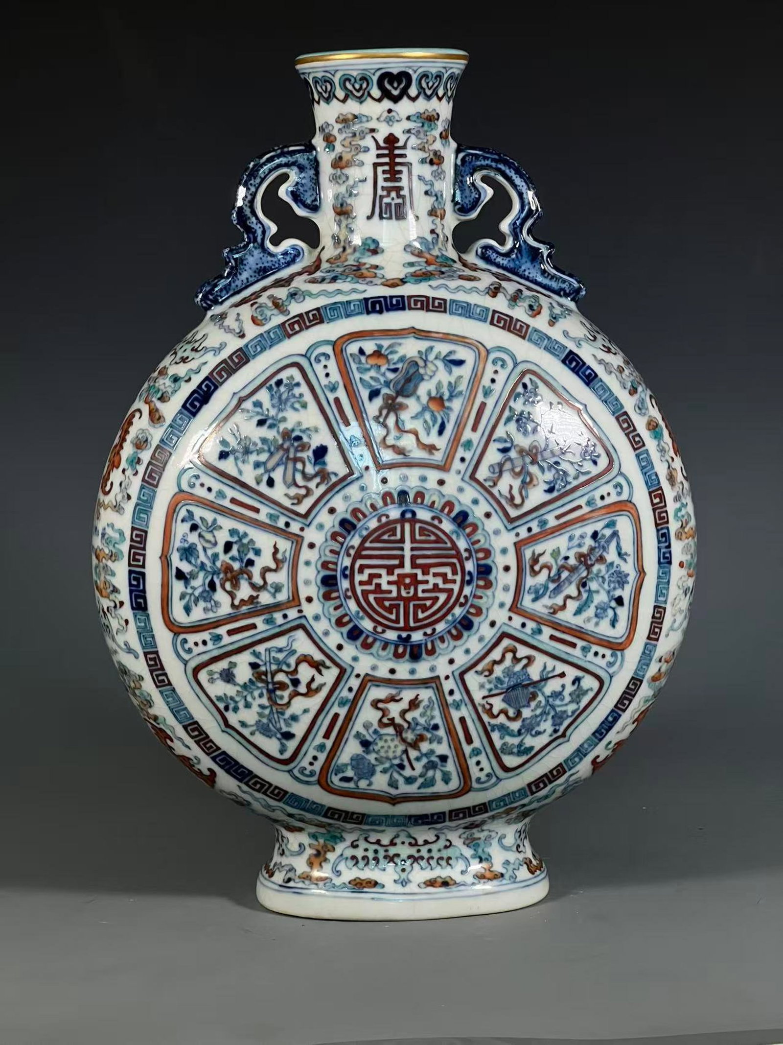 An Exquisite Blue and White Doucai Painted Gold Auspicious Cloud and Eight Treasures Pattern: An Exquisite Blue and White Doucai Painted Gold Auspicious Cloud and Eight Treasures Pattern Double-Ears Vase,Qing Dynasty,China,Qianlong Six-character Mark,Size:15.7inx3.1inx5.5in