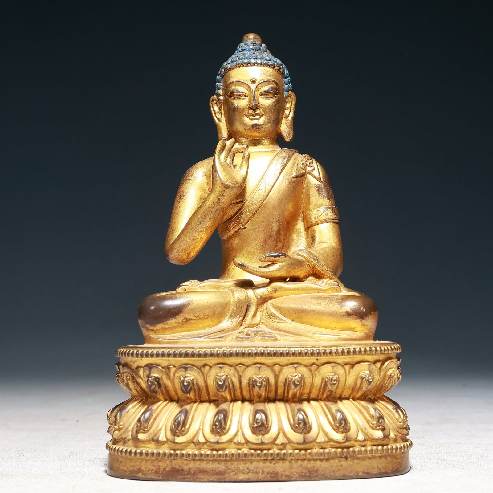 A Solemn Gilt Bronze Statue of Sakyamuni: A Solemn Gilt Bronze Statue of Sakyamuni,Qing Dynasty,China,Size:5.3inx3.5inx8.7in,Weight:2250g 铜鎏金如来像,中国清代