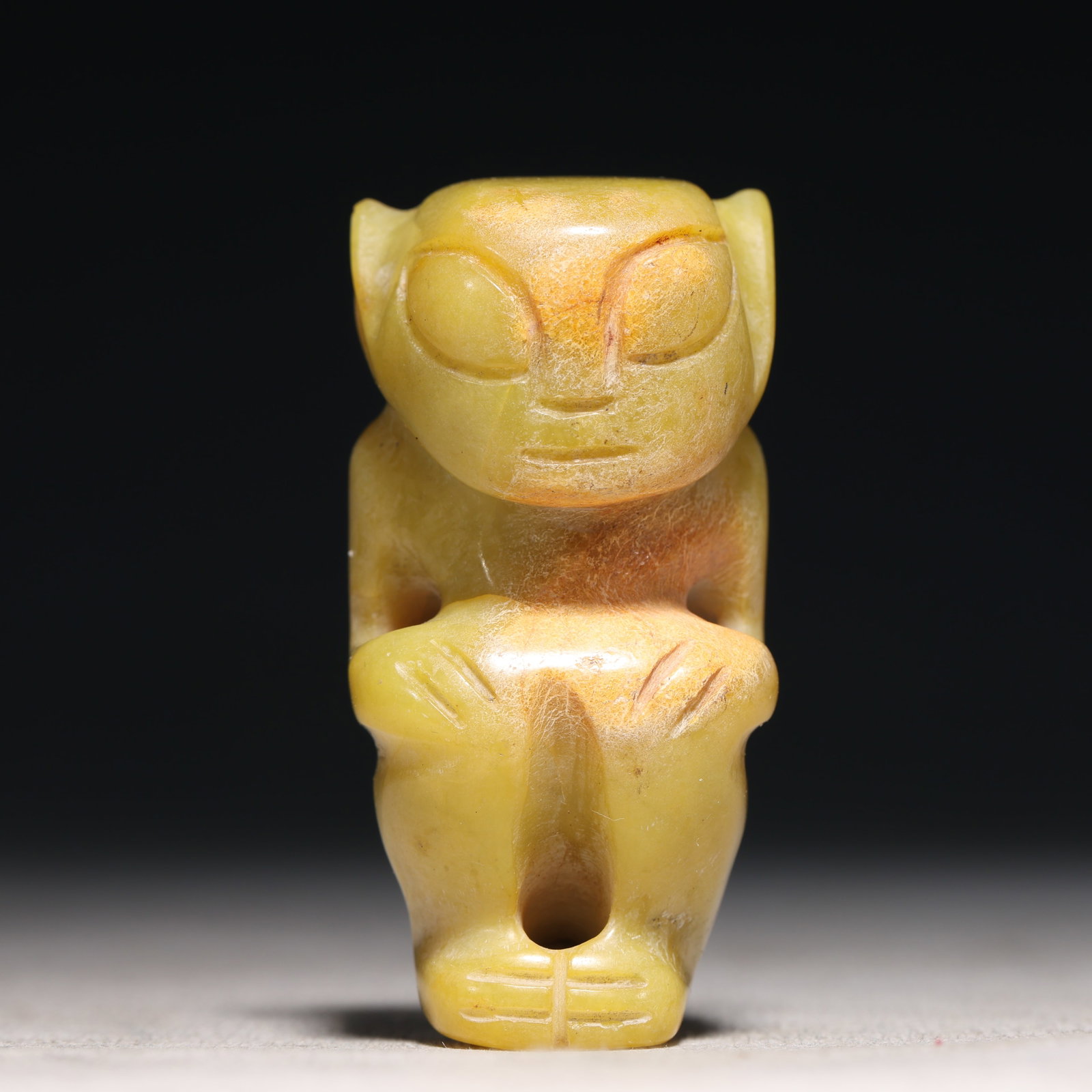 An Archaic Hongshan Culture Yellow Jade Figure Ornament: An Archaic Hongshan Culture Yellow Jade Figure Ornament,Ancient Time, China,Size:1.2inx1inx3.5in Weight:81.3g 红山文化黄玉人物摆件,新&