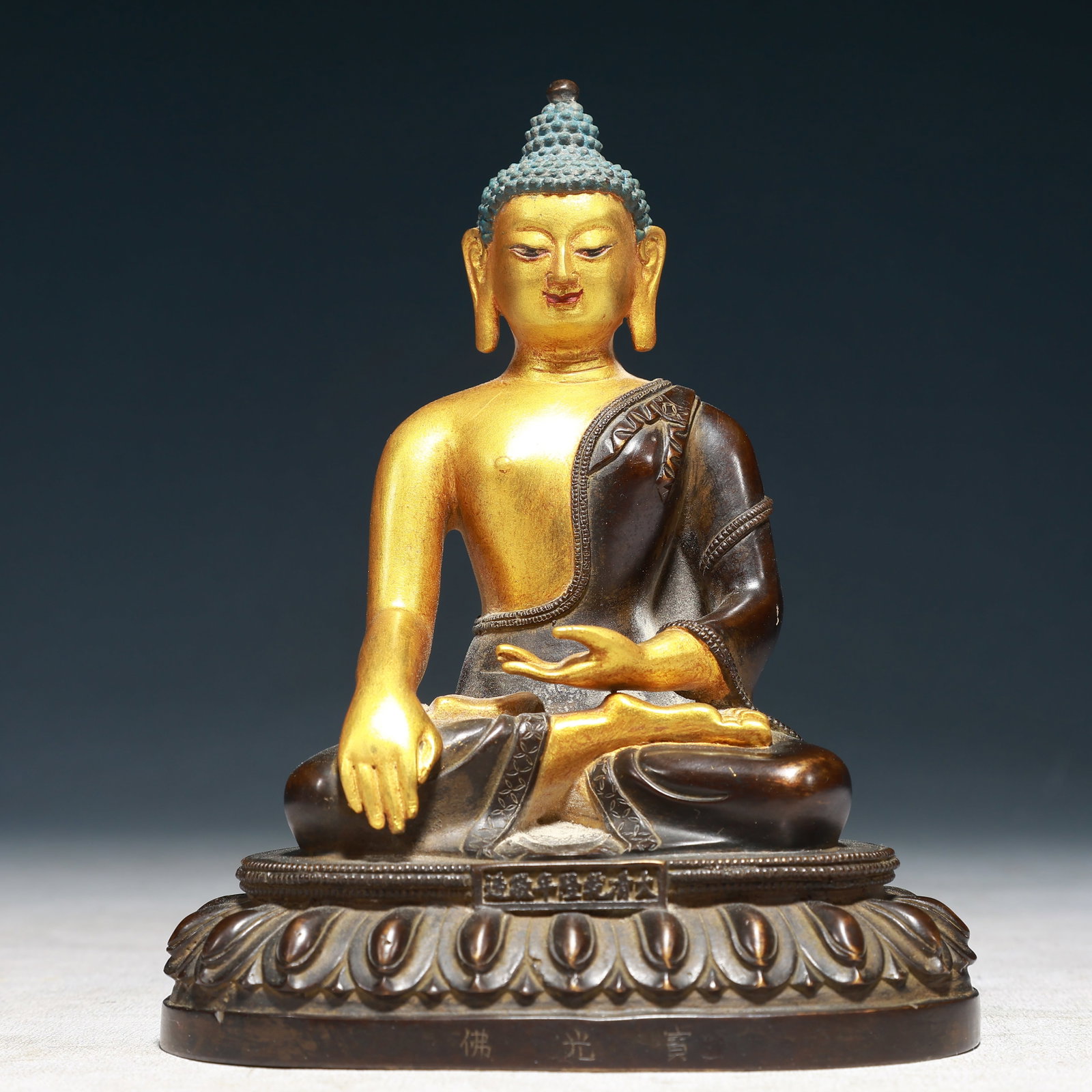 A Solemn Gilt Bronze Statue of Sakyamuni: A Solemn Gilt Bronze Statue of Sakyamuni,Qing Dynasty,China,Qianlong Mark,Size:5.1inx3.7inx6.7in,Weight:1350g