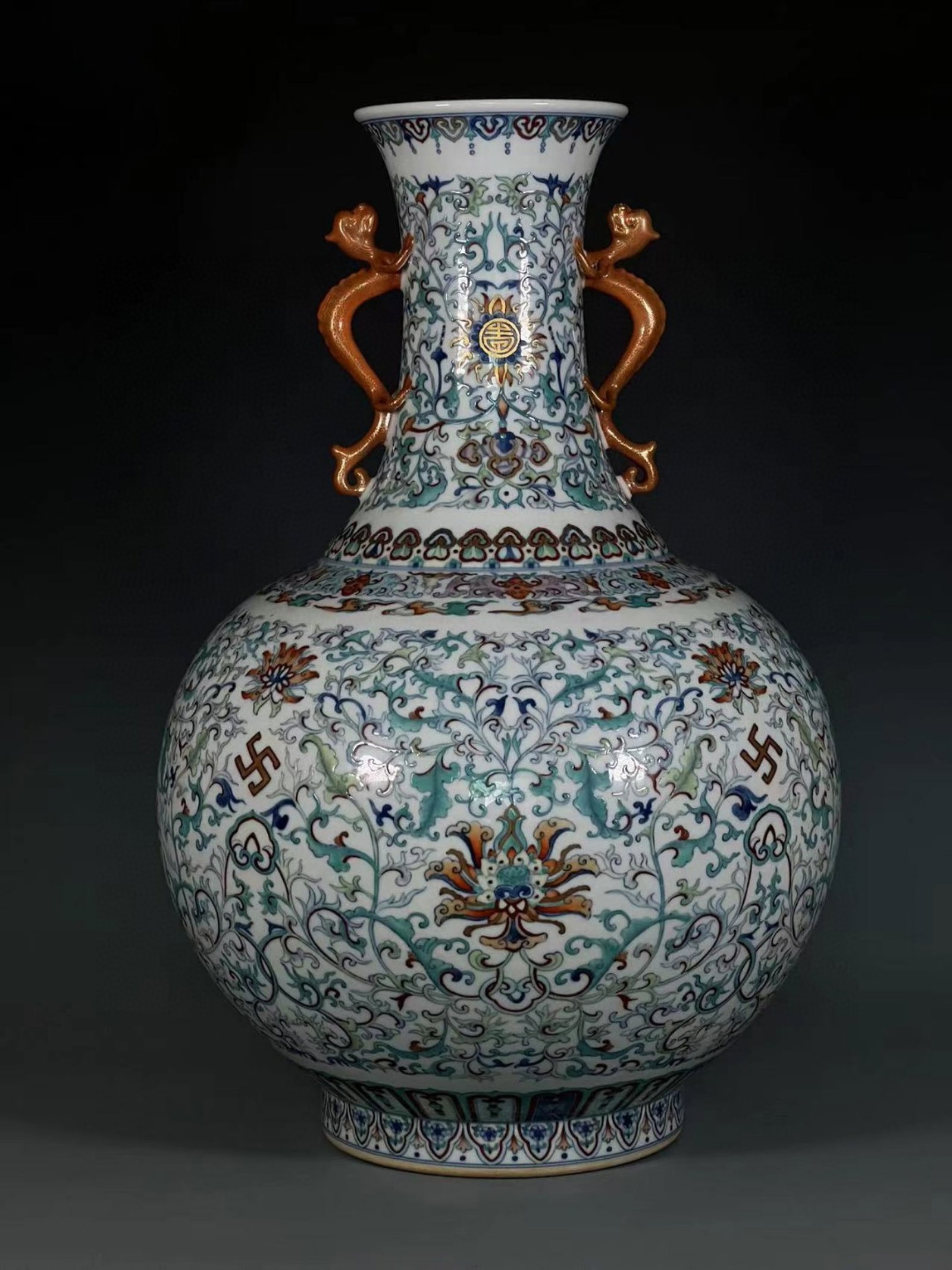An Exquisite Doucai Painted Gold Lotus Pattern Dragon-Ears Vase: An Exquisite Doucai Painted Gold Lotus Pattern Dragon-Ears Vase,Qing Dynasty,China,Qianlong Six-character Mark,Size:20.9inx5.4inx7.4in 斗彩描金缠枝莲纹&