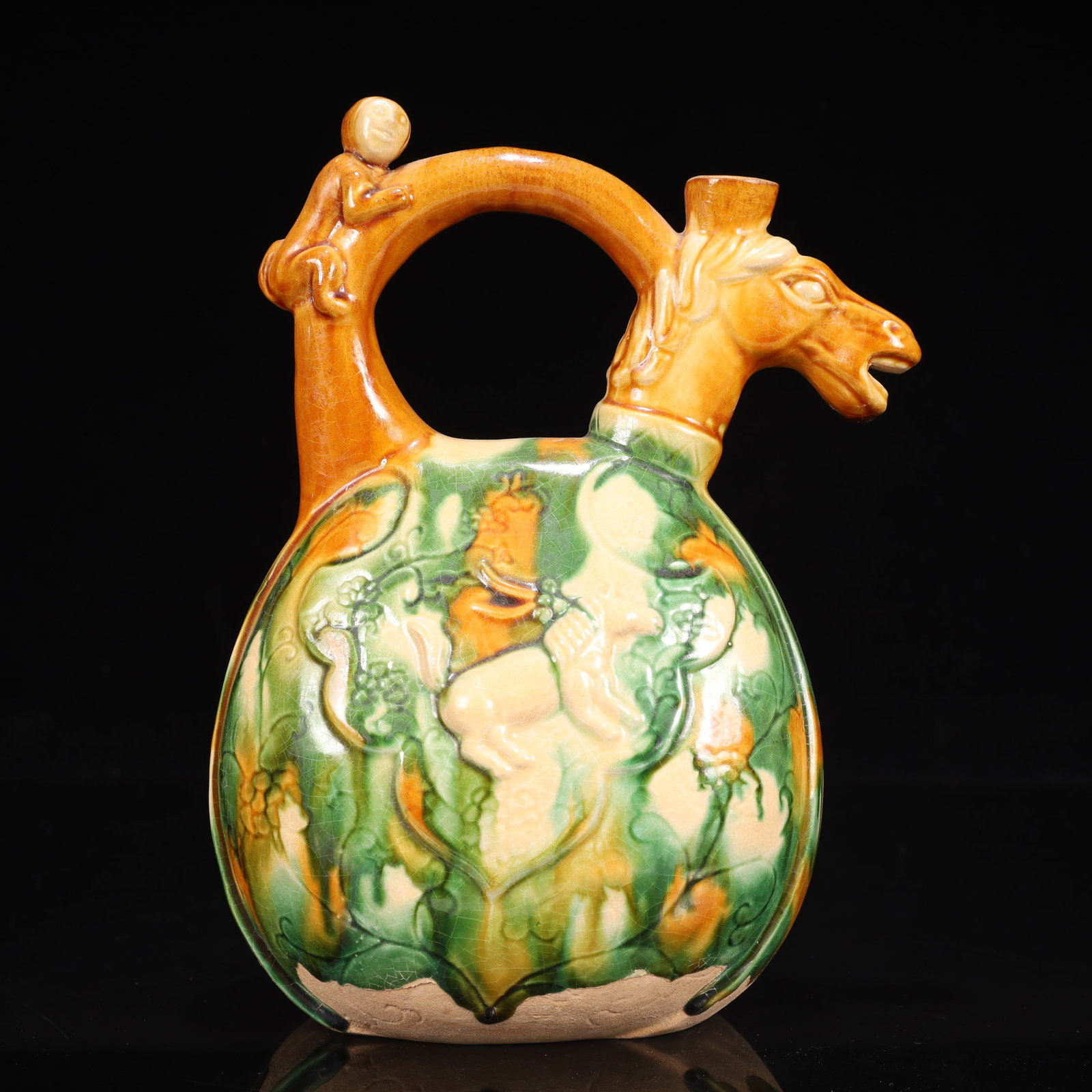 A Rare Tang Tri-Color Glazed Pottery Horse Head Ewer: A Rare Tang Tri-Color Glazed Pottery Horse Head Ewer,Tang Dynasty, China,Chinese Tang Tri-colored Pottery, or Tang Sancai, flourished during the Tang Dynasty (618–907 AD). It's renowned for its 