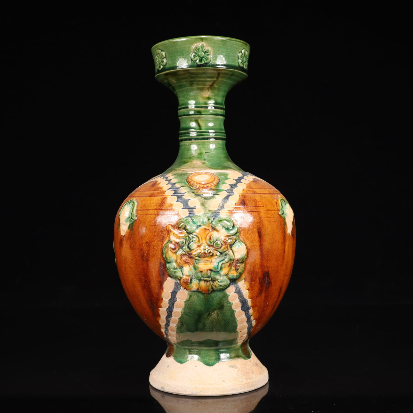 A Rare Tang Tri-Color Glazed Pottery Lion Pattern Vase: A Rare Tang Tri-Color Glazed Pottery Lion Pattern Vase,Tang Dynasty, China,Chinese Tang Tri-colored Pottery, or Tang Sancai, flourished during the Tang Dynasty (618–907 AD). It's renowned for it